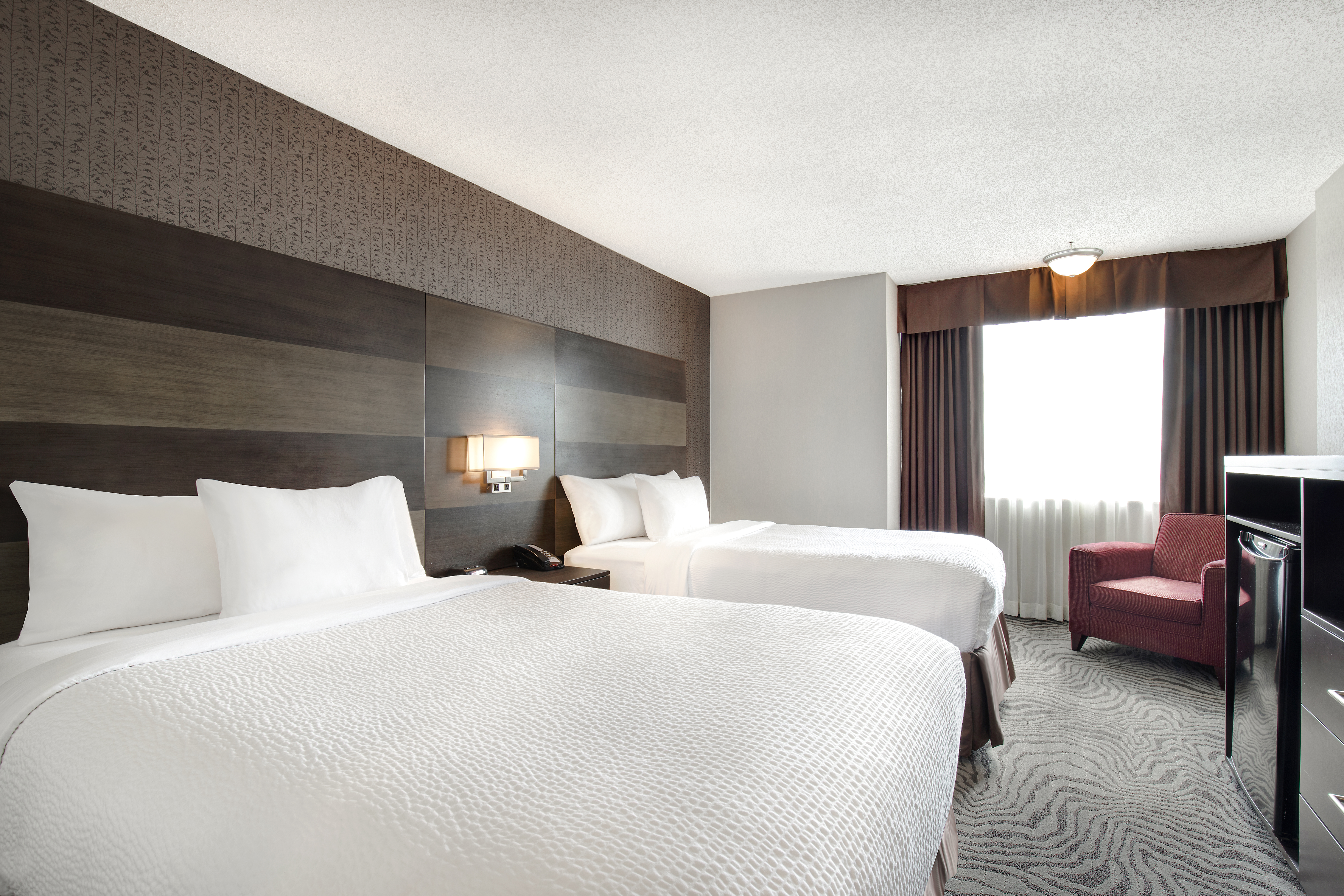 Guest room at the Days Inn by Wyndham Calgary South in Calgary, Alberta