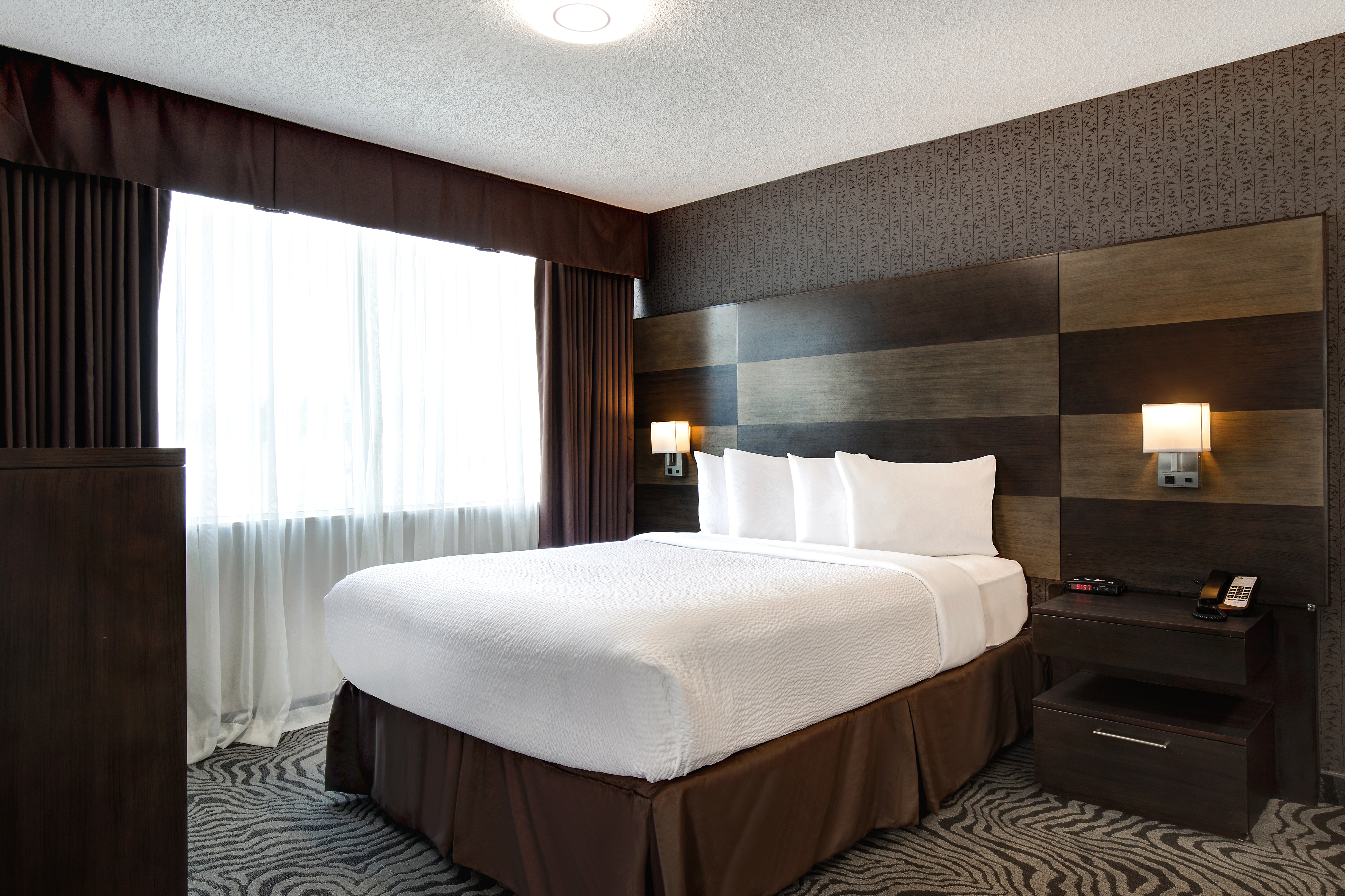 Guest room at the Days Inn by Wyndham Calgary South in Calgary, Alberta