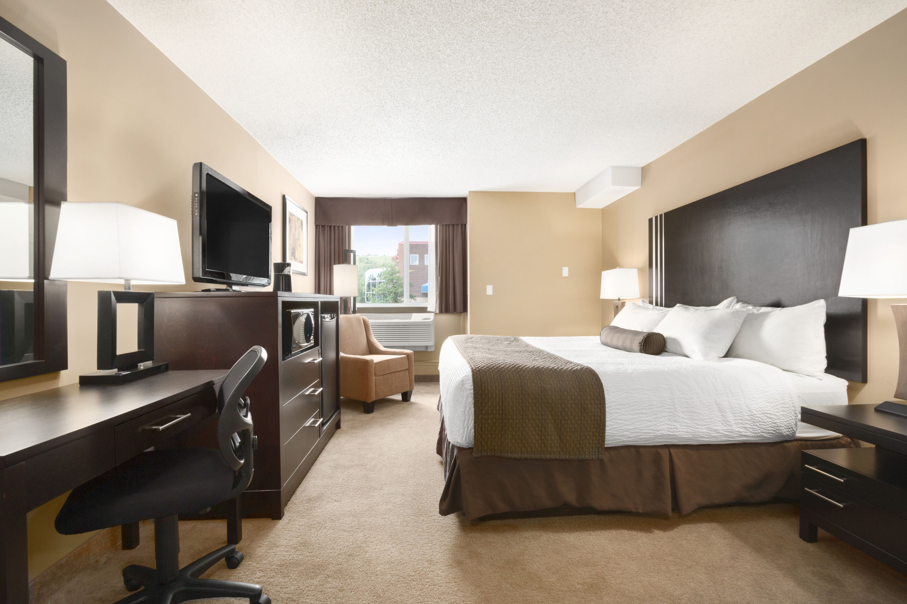 Guest room at the Days Inn by Wyndham Calgary Northwest in Calgary, Alberta