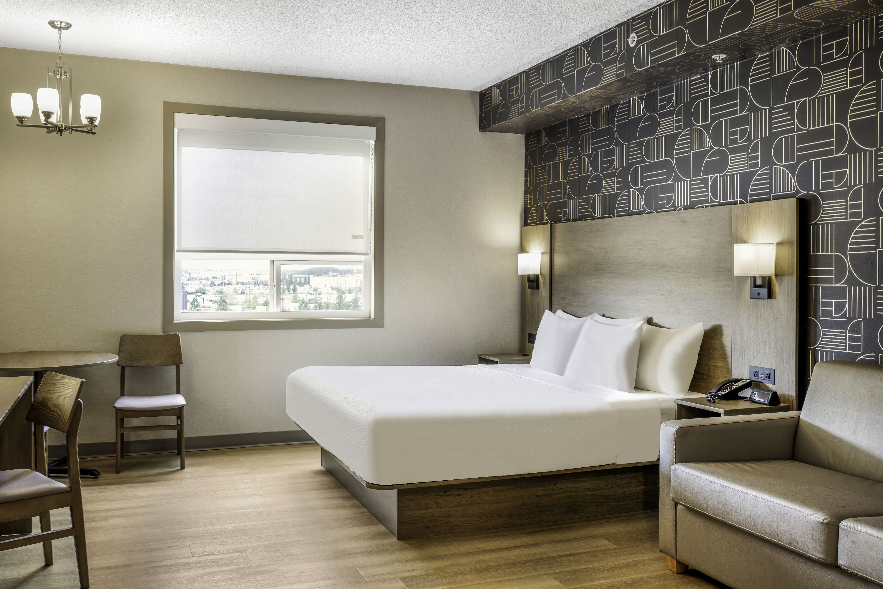 King bed guest room at the Days Inn & Suites by Wyndham West Edmonton in Edmonton, Alberta