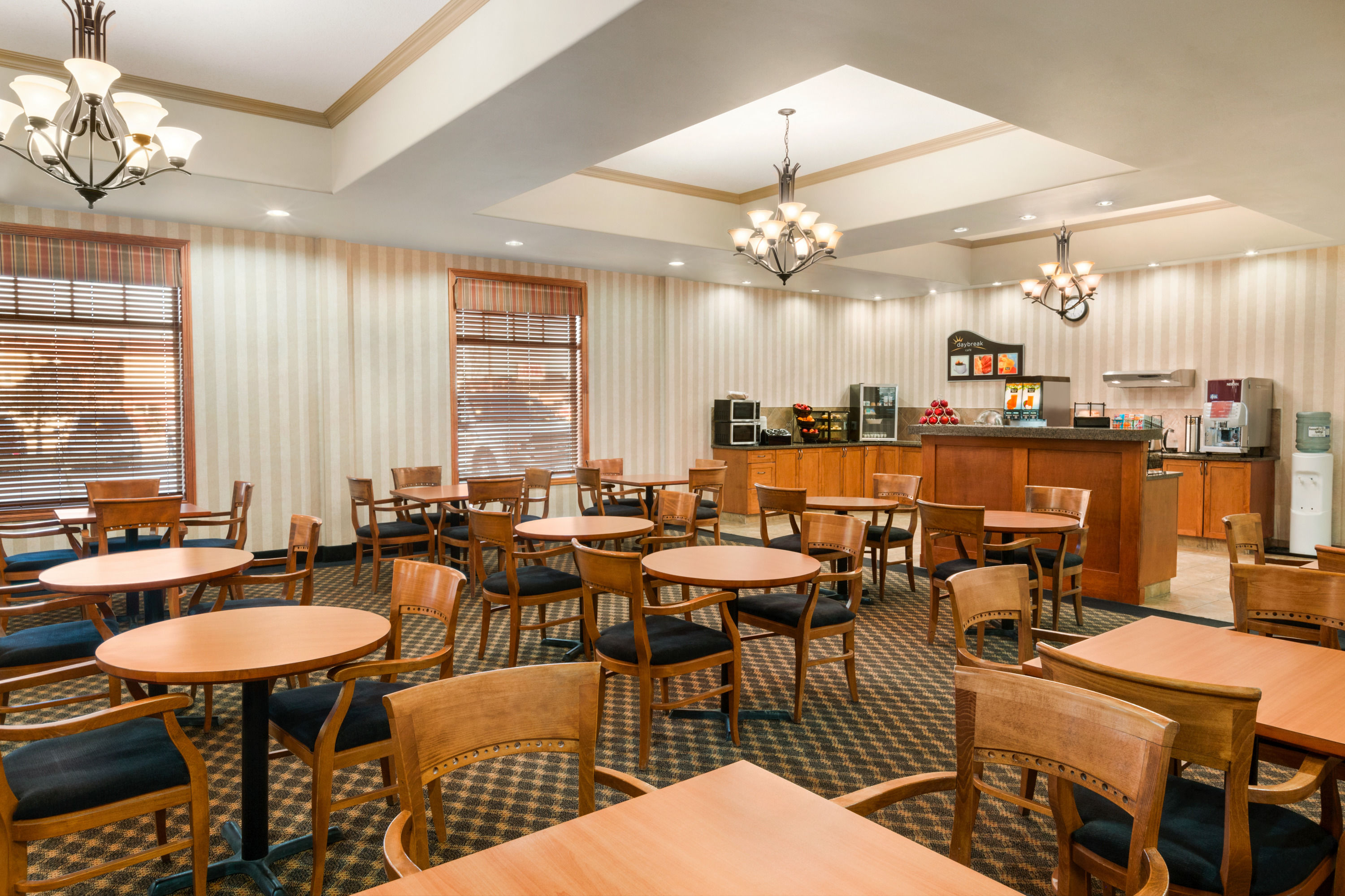 Days Inn & Suites by Wyndham Edmonton Airport restaurant breakfast area with seating in Leduc, Alberta