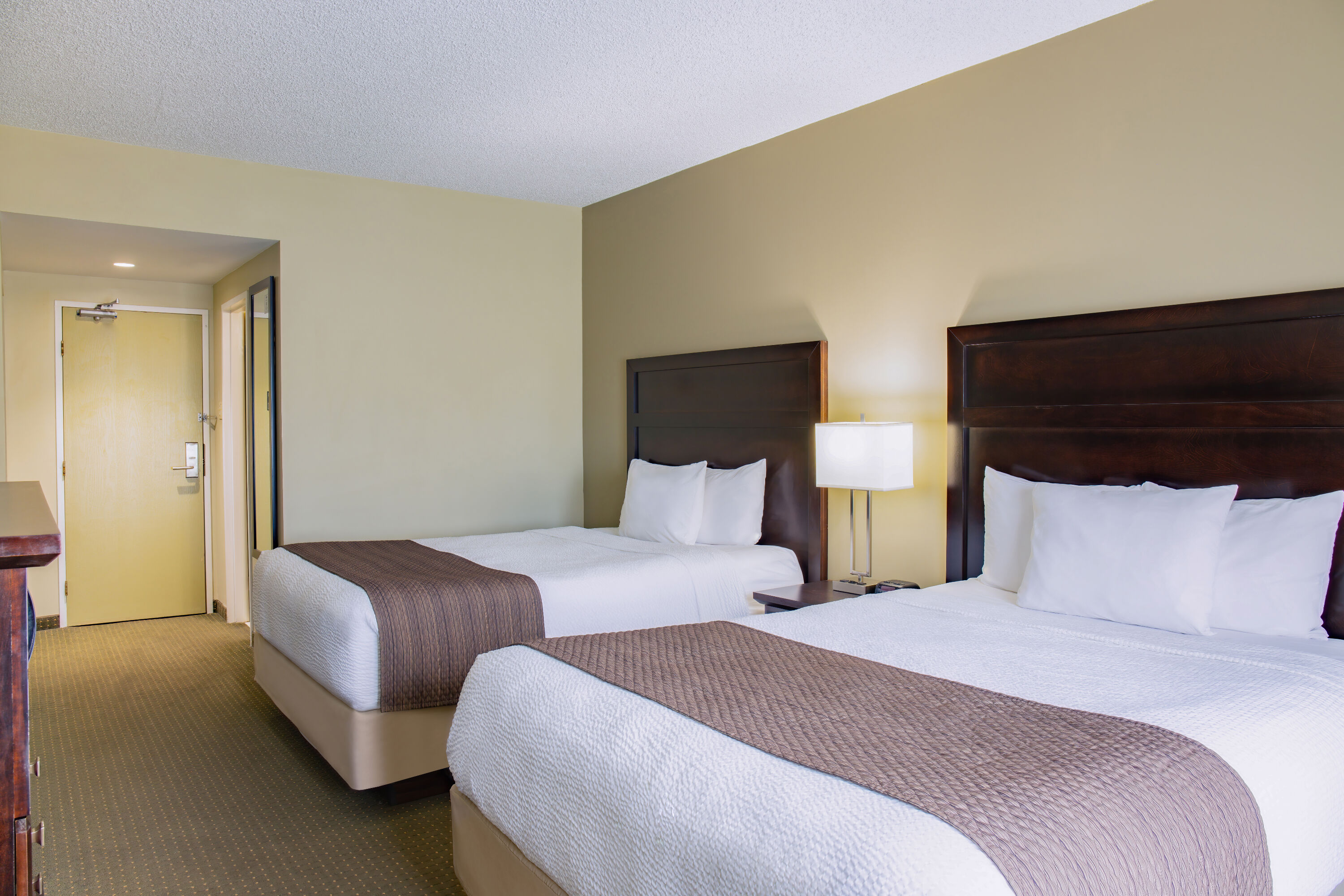 Queen bed guest room at the Days Inn by Wyndham Cranbrook Conference Centre in Cranbrook, British Columbia