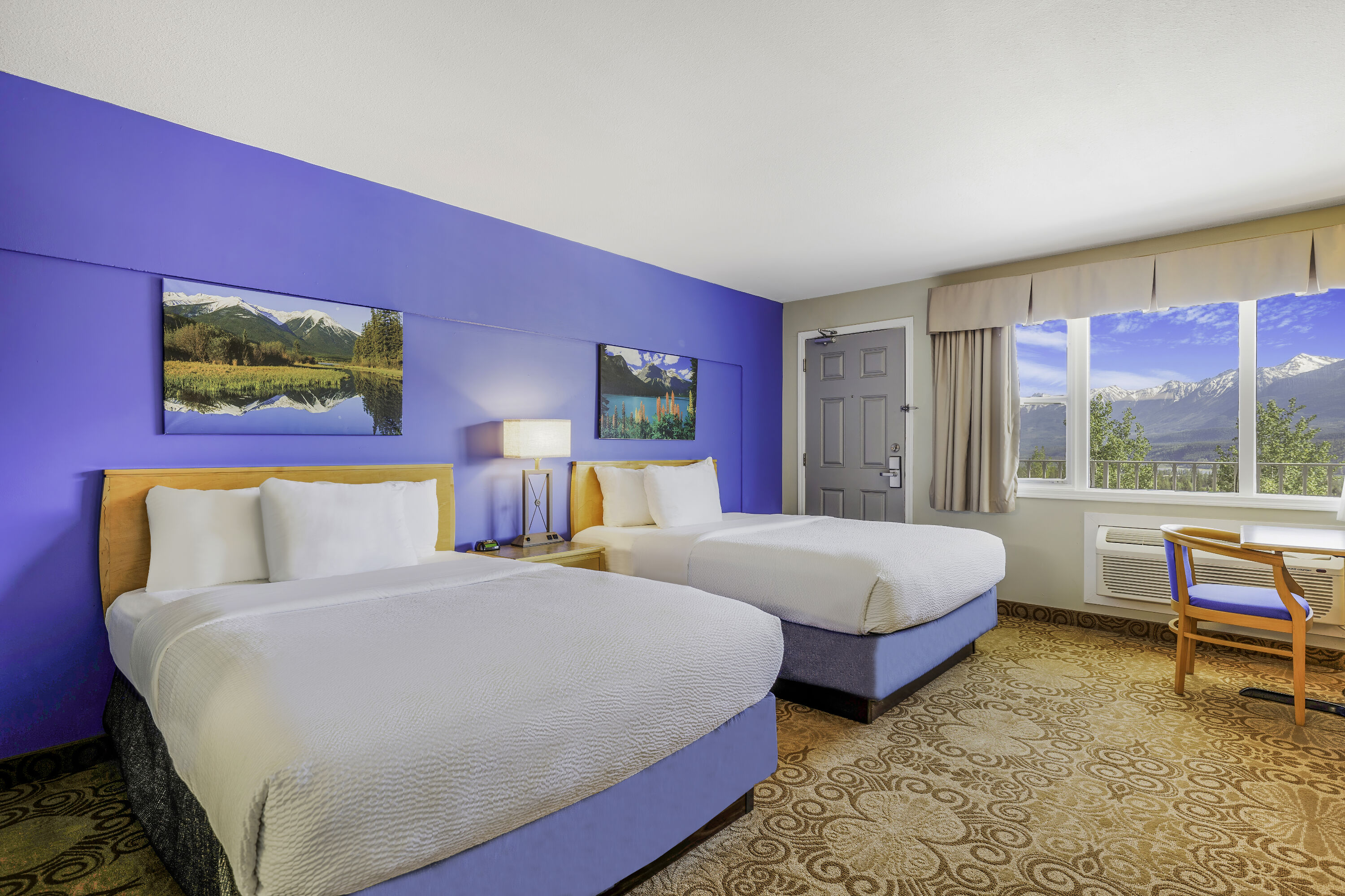 Queen bed guest room at the Days Inn by Wyndham Golden in Golden, British Columbia