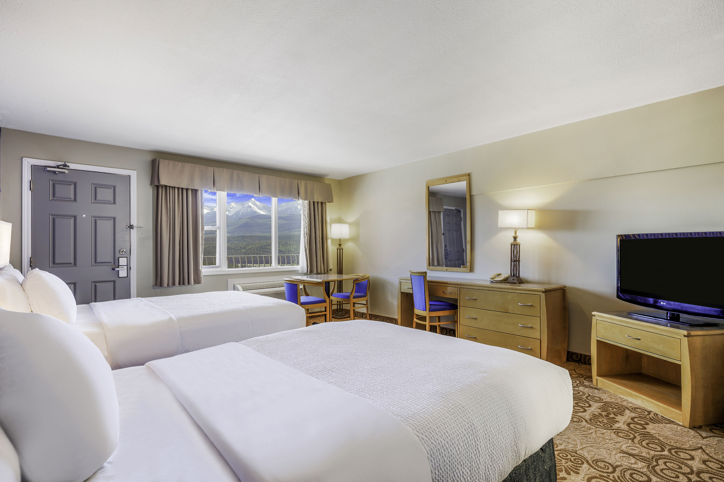 Queen bed guest room at the Days Inn by Wyndham Golden in Golden, British Columbia