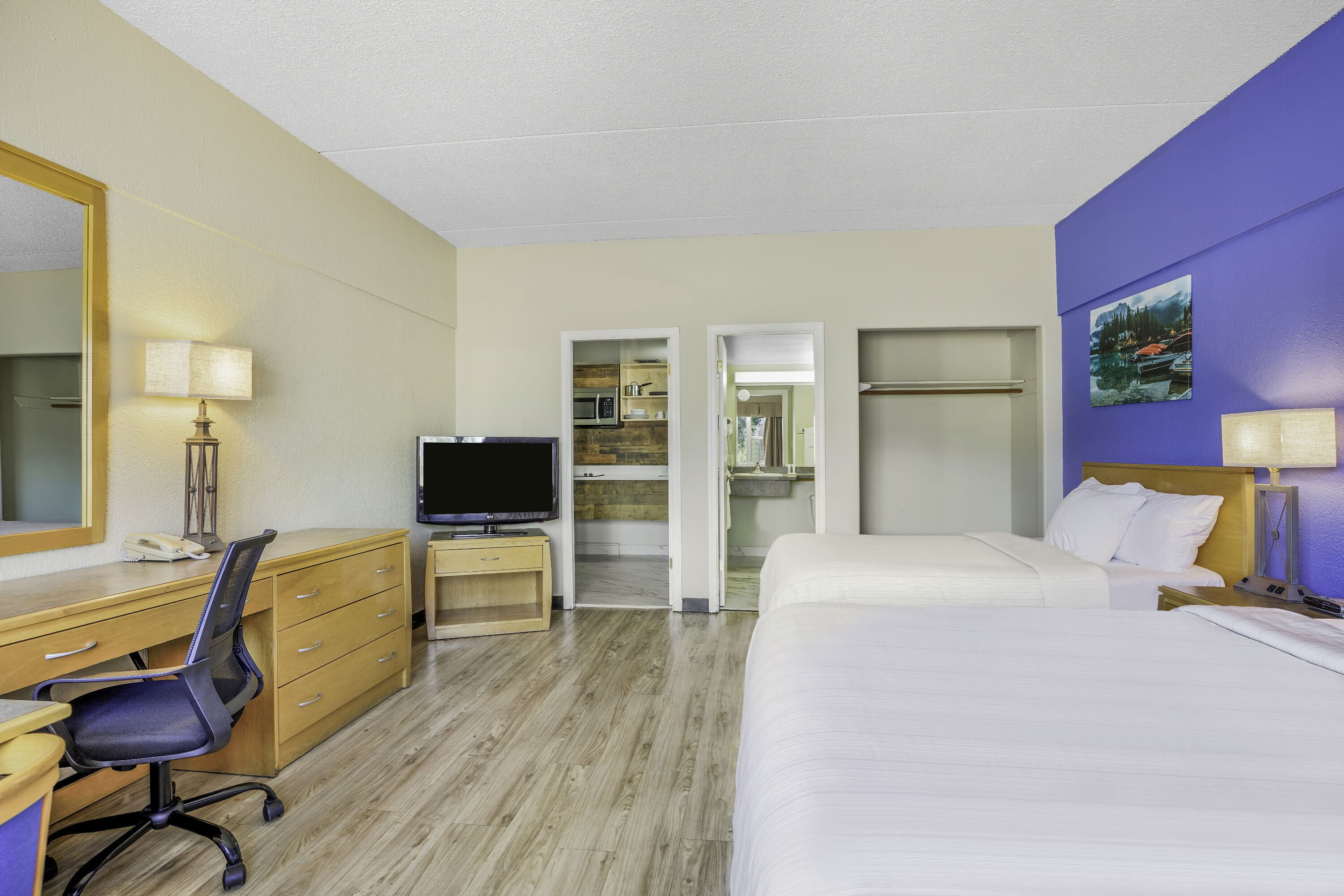 Queen bed guest room at the Days Inn by Wyndham Golden in Golden, British Columbia
