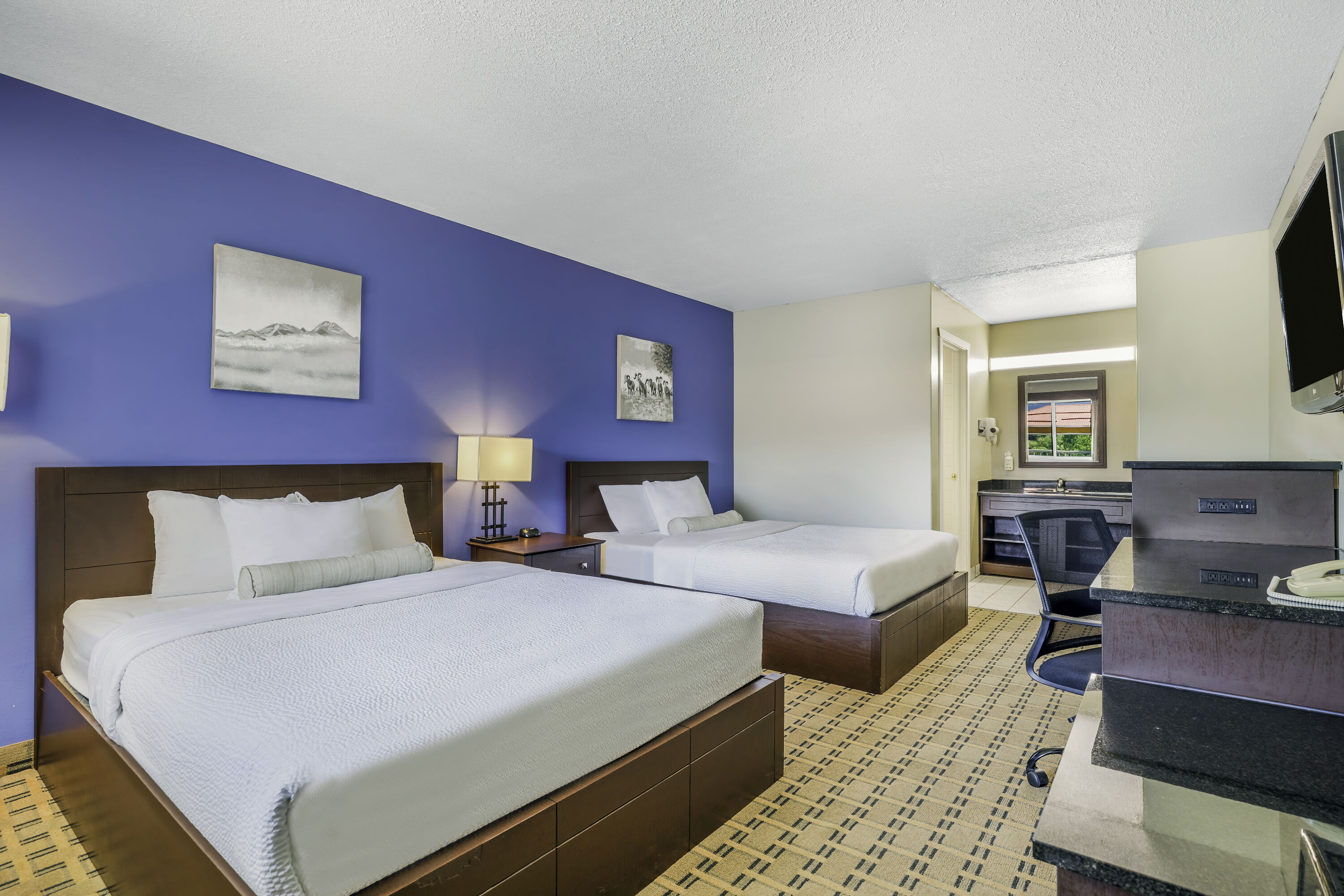 Queen bed guest room at the Days Inn by Wyndham Golden in Golden, British Columbia