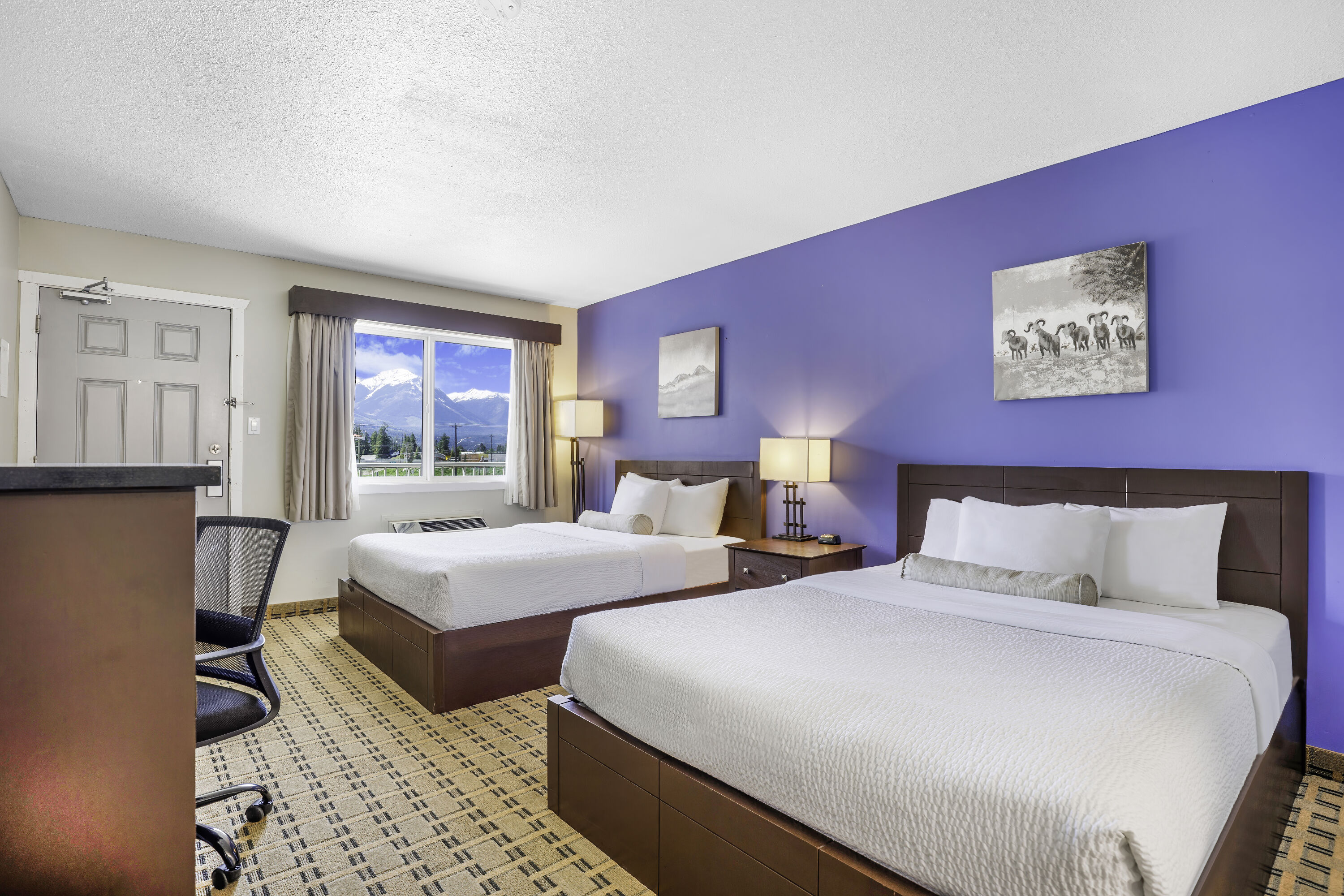 Queen bed guest room at the Days Inn by Wyndham Golden in Golden, British Columbia