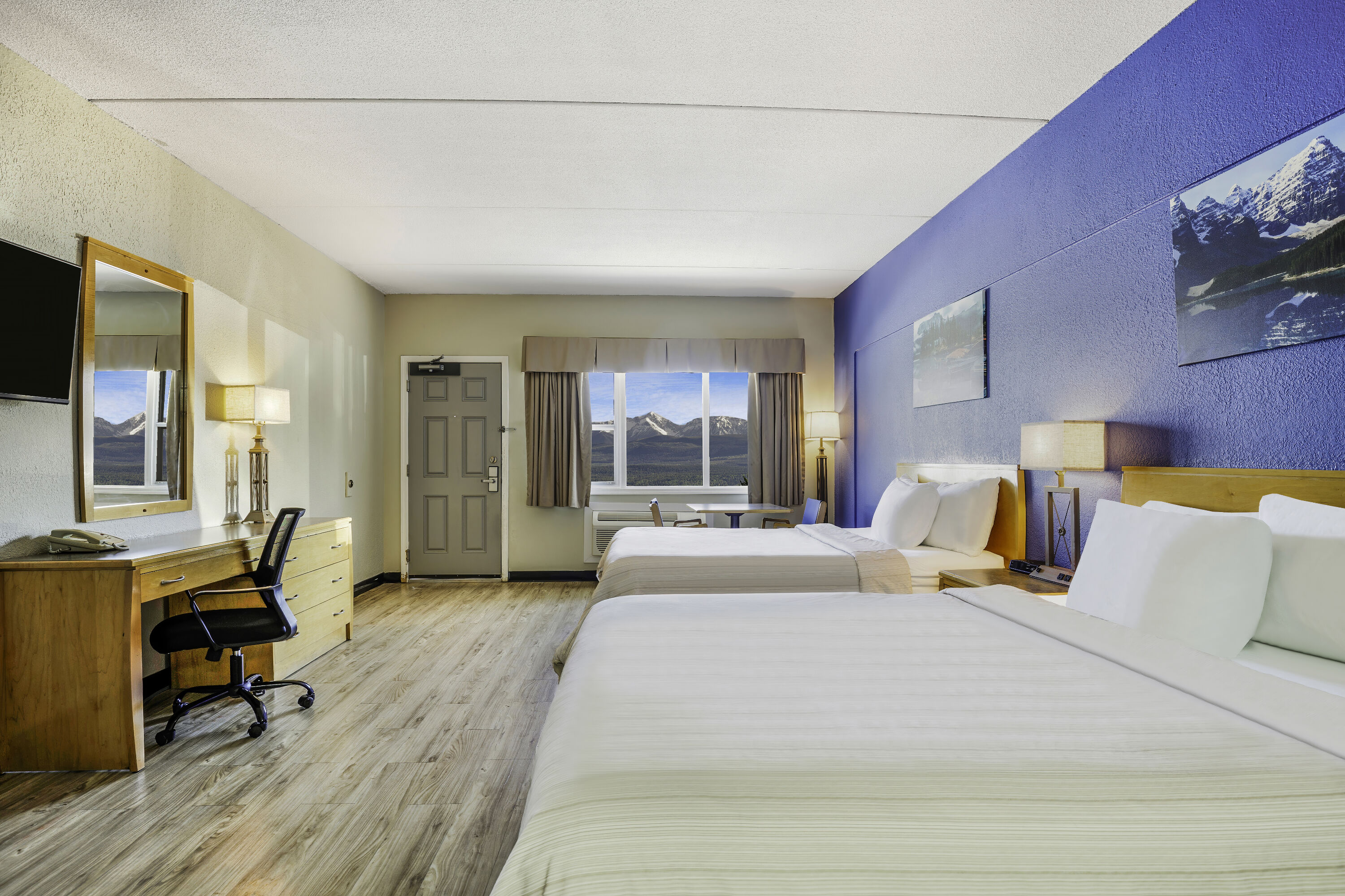 Queen bed guest room at the Days Inn by Wyndham Golden in Golden, British Columbia