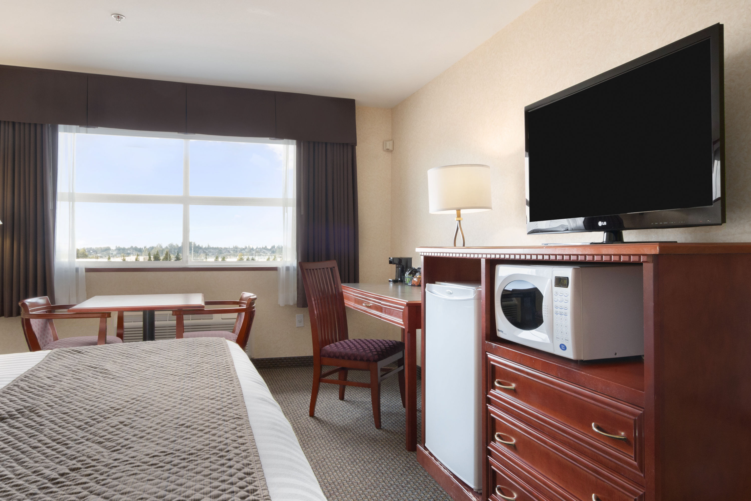 Guest room at the Days Inn & Suites by Wyndham Langley in Langley, British Columbia