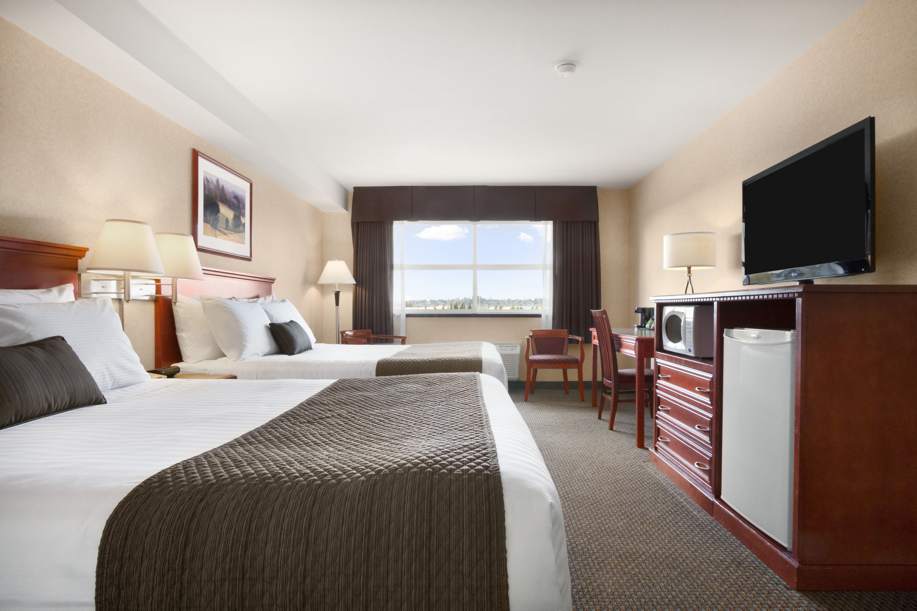 Guest room at the Days Inn & Suites by Wyndham Langley in Langley, British Columbia