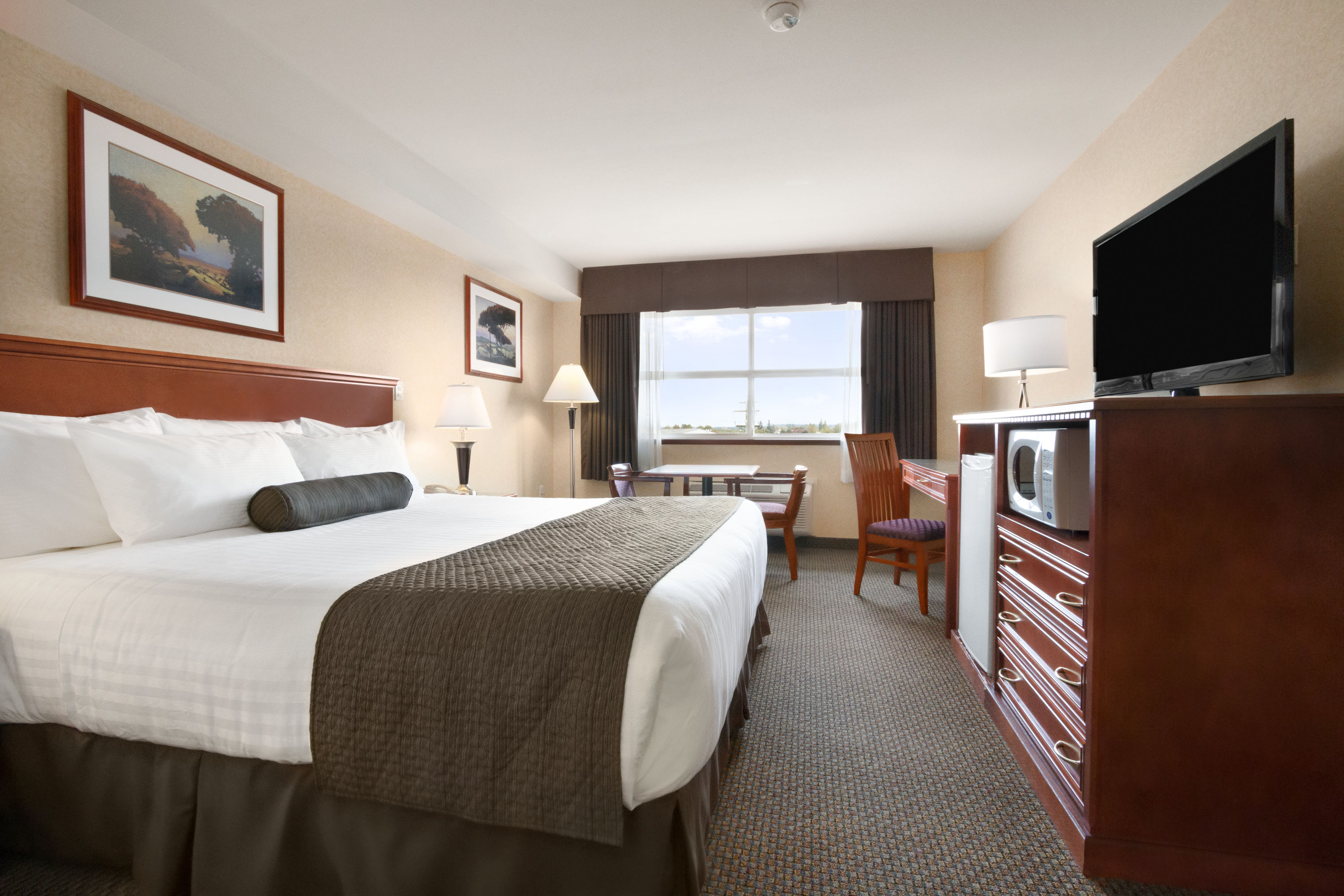 Guest room at the Days Inn & Suites by Wyndham Langley in Langley, British Columbia
