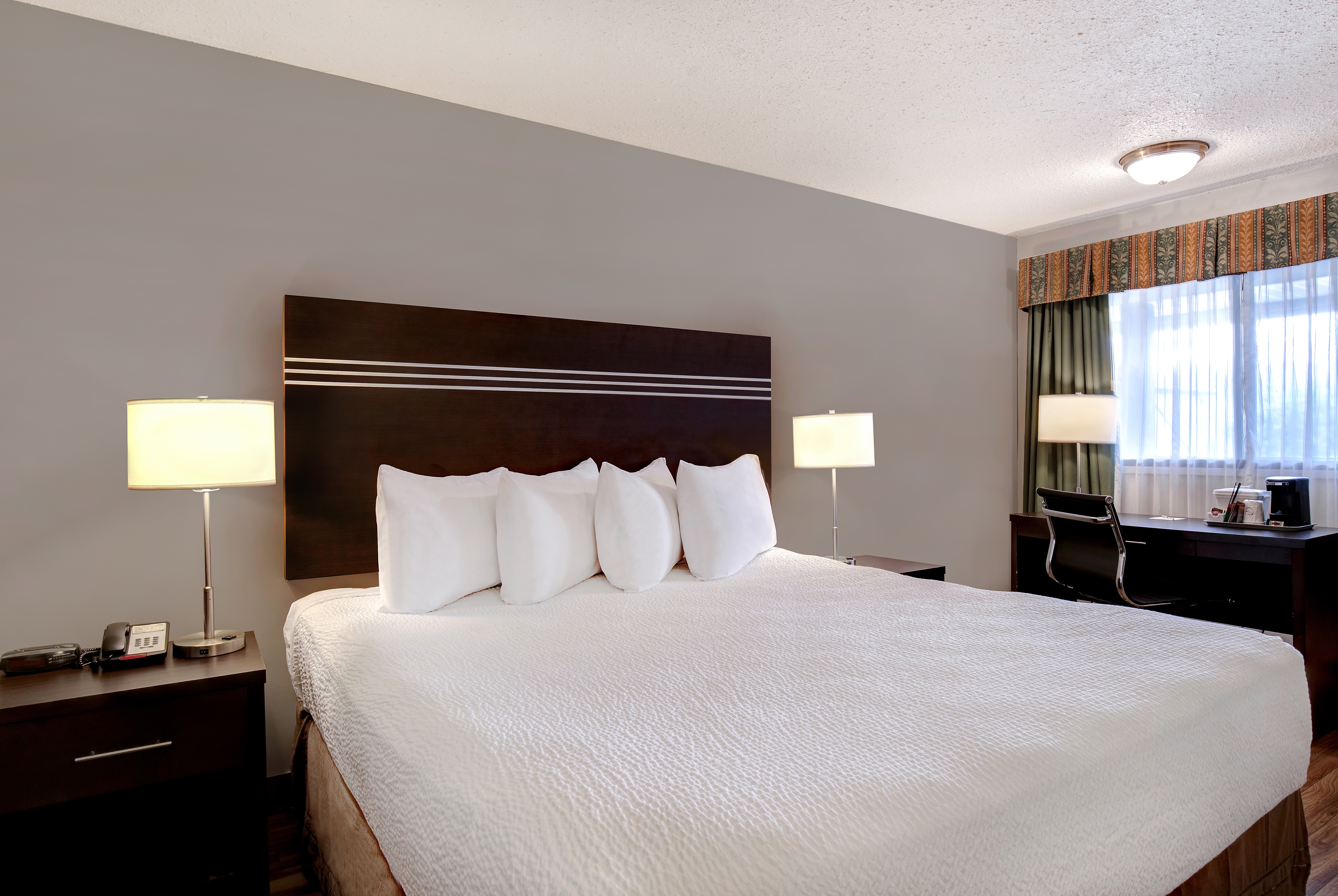 King bed guest room at the Days Inn by Wyndham Vernon in Vernon, British Columbia