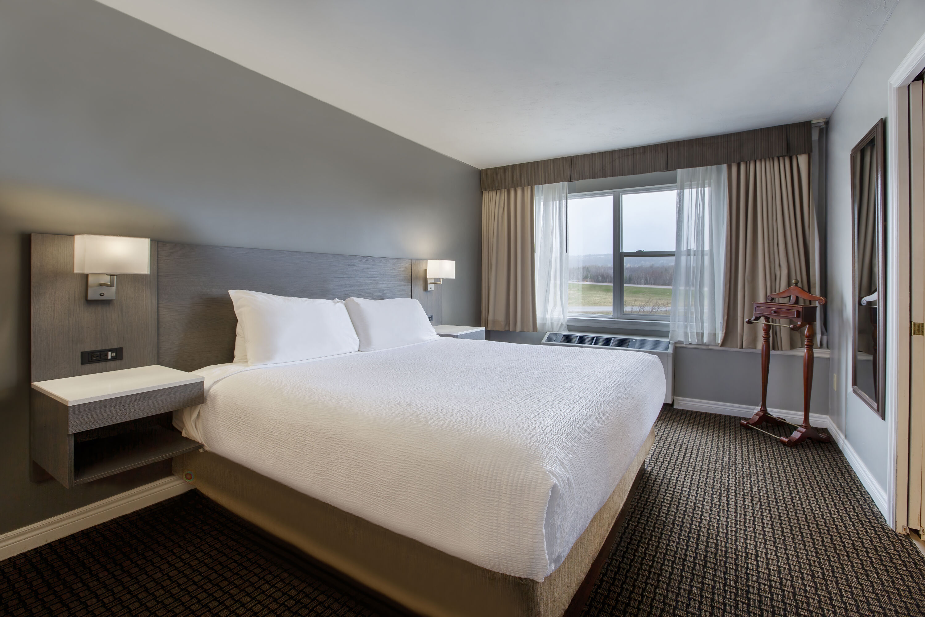 Guest room at the Days Inn & Suites by Wyndham Moncton in Moncton, New Brunswick