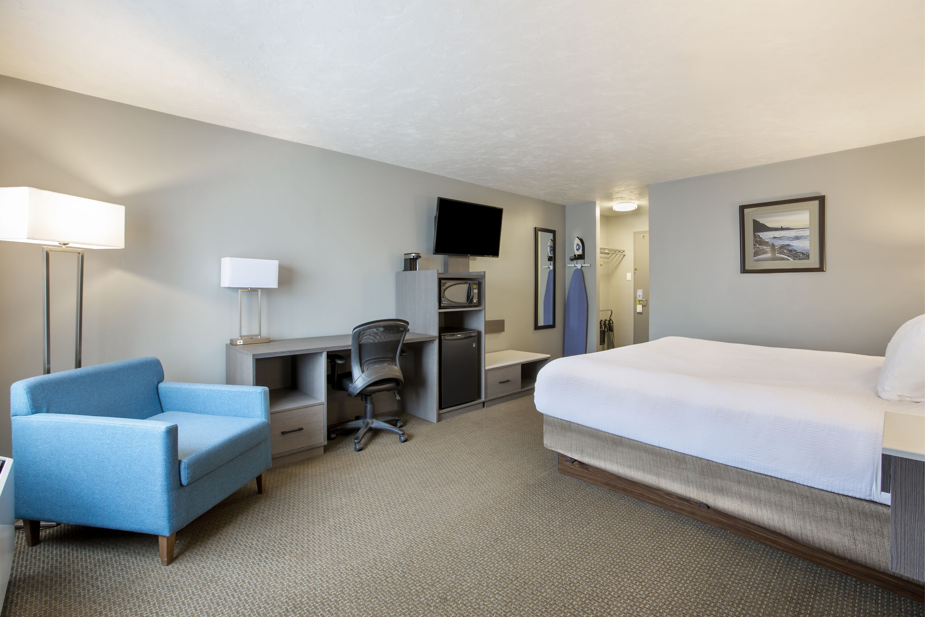 King bed guest room at the Days Inn & Suites by Wyndham Moncton in Moncton, New Brunswick