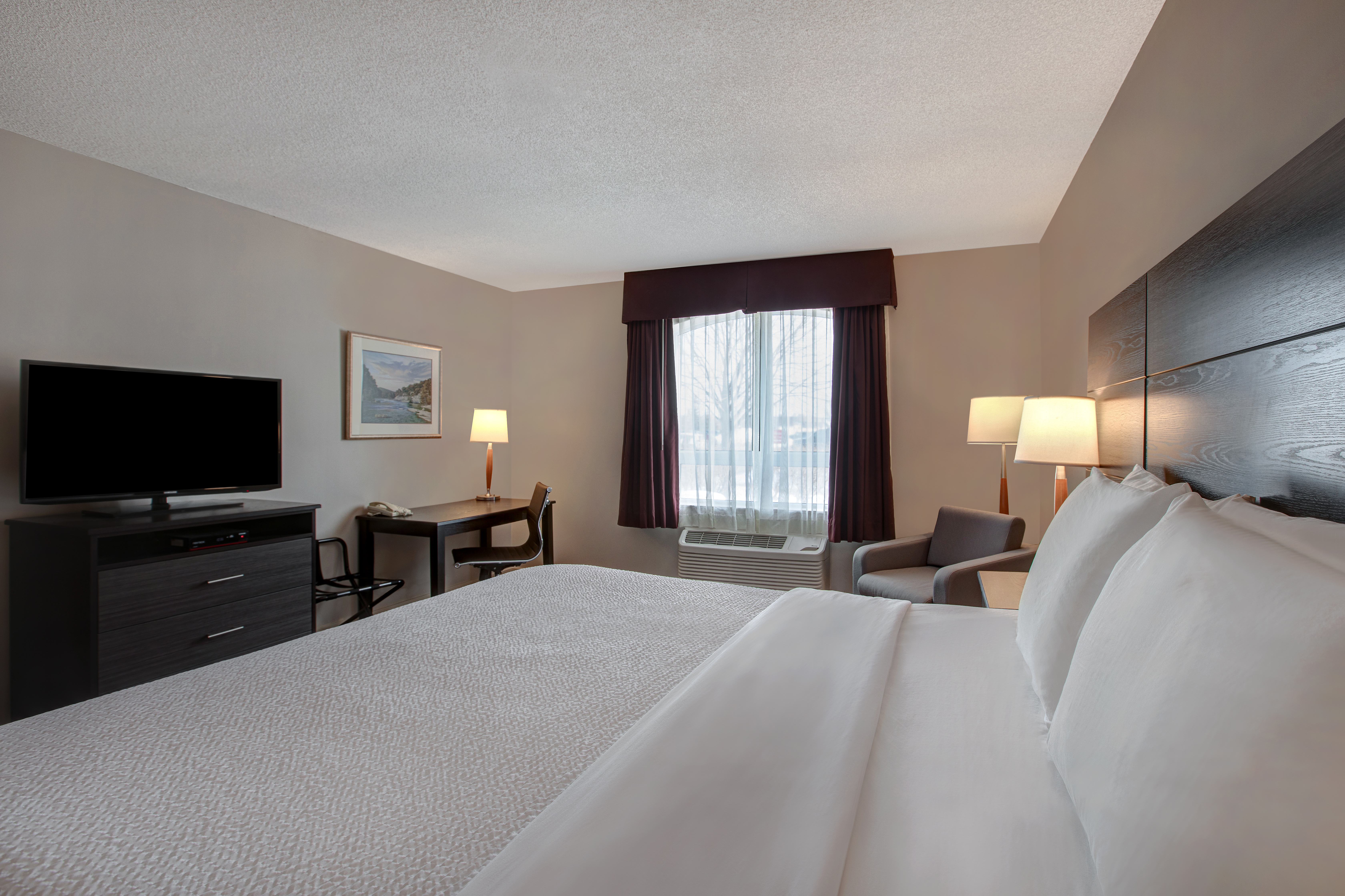 Guest room at the Days Inn & Suites by Wyndham Collingwood in Collingwood, Ontario