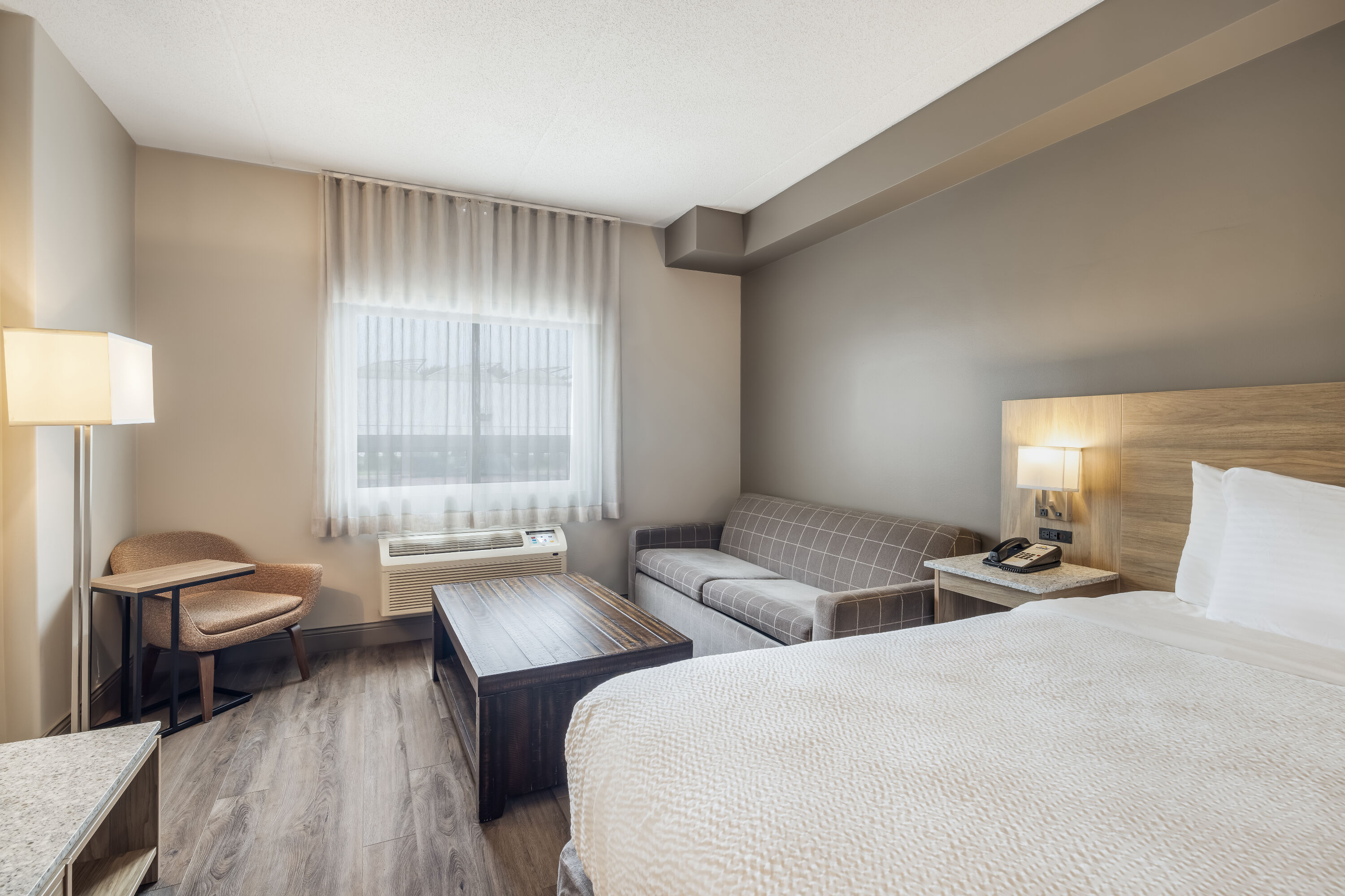 King bed guest room at the Days Inn by Wyndham Leamington in Leamington, Ontario