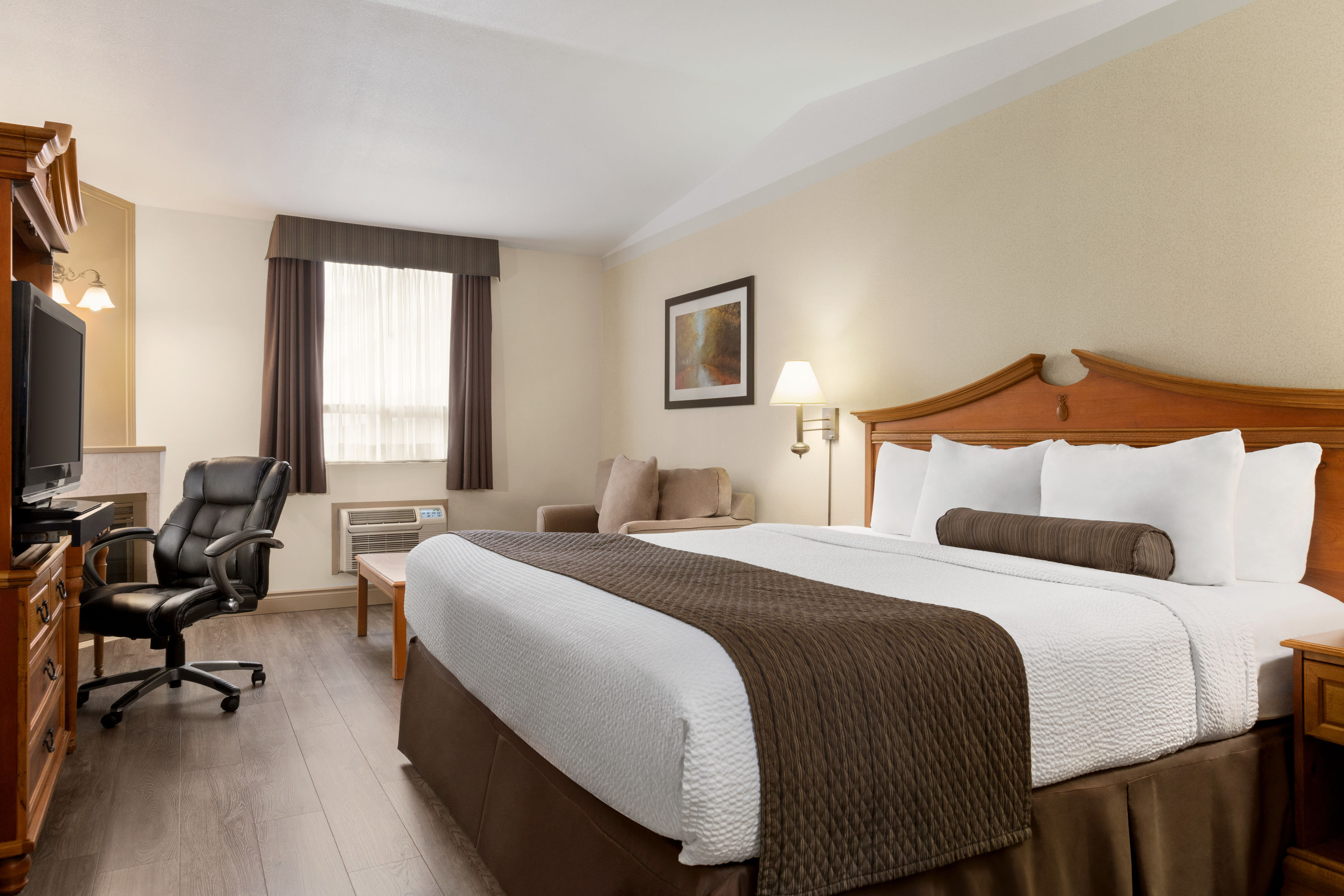 Guest room at the Days Inn & Suites by Wyndham Sault Ste. Marie ON in Sault Ste Marie, Ontario