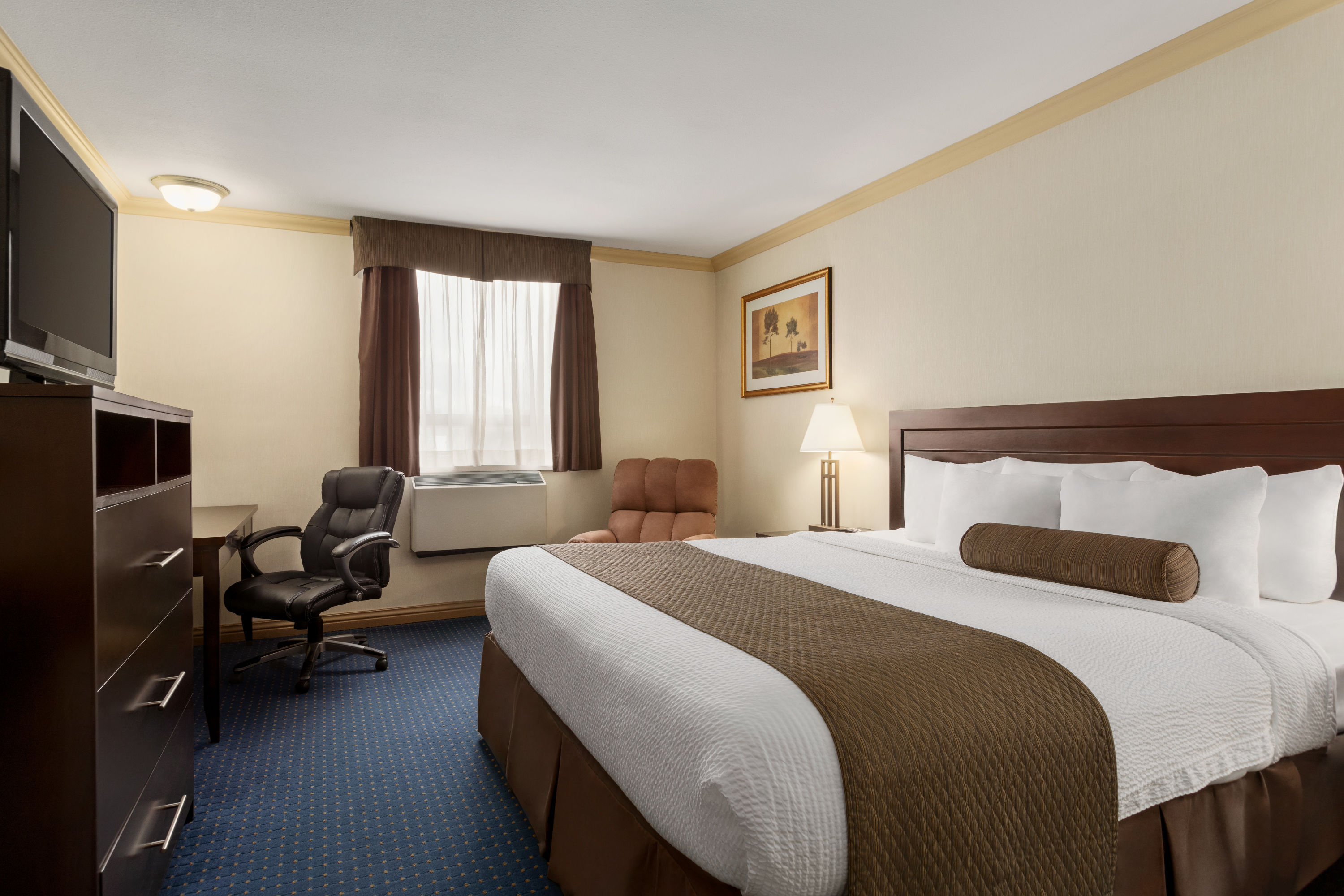 Guest room at the Days Inn & Suites by Wyndham Sault Ste. Marie ON in Sault Ste Marie, Ontario
