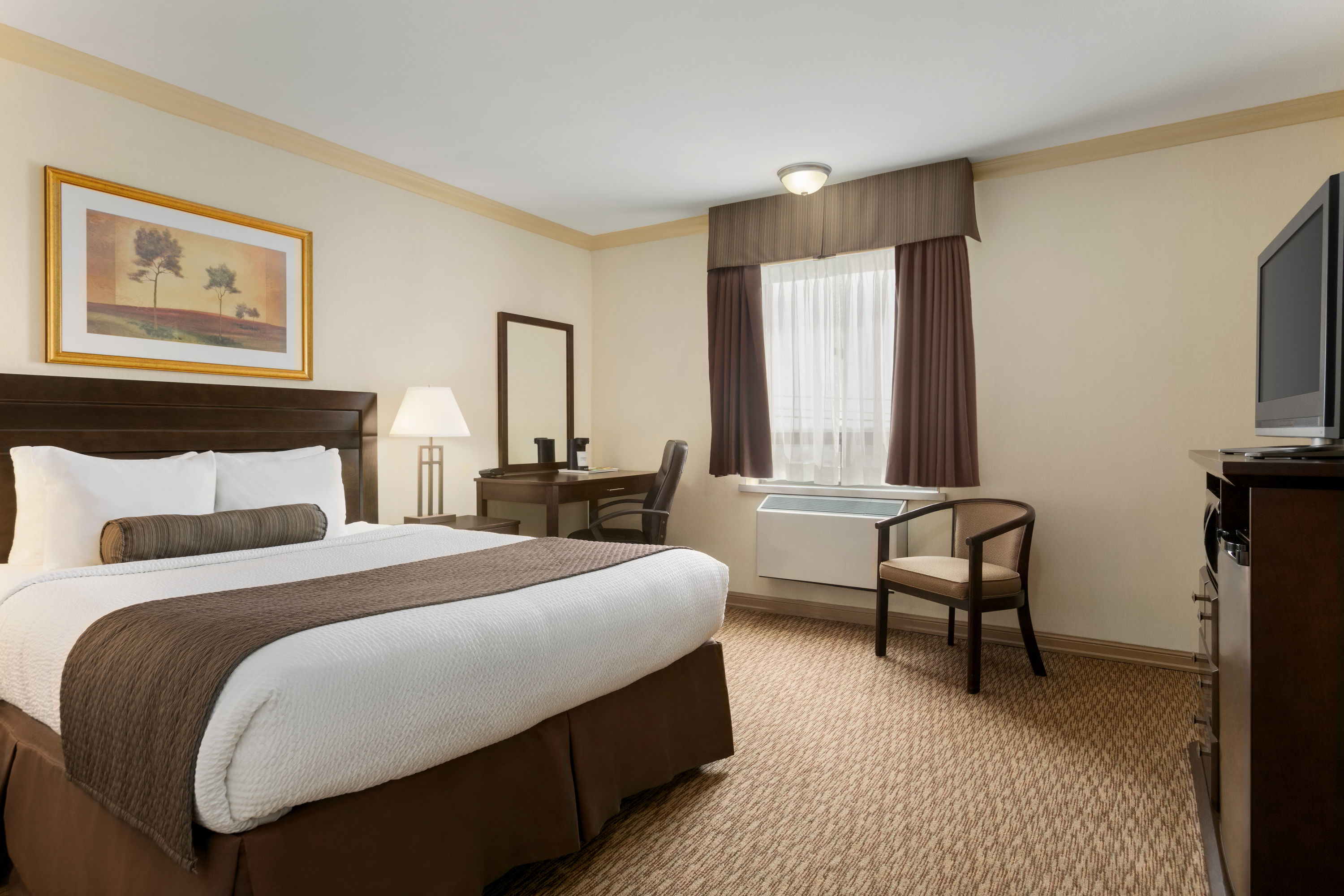 Guest room at the Days Inn & Suites by Wyndham Sault Ste. Marie ON in Sault Ste Marie, Ontario