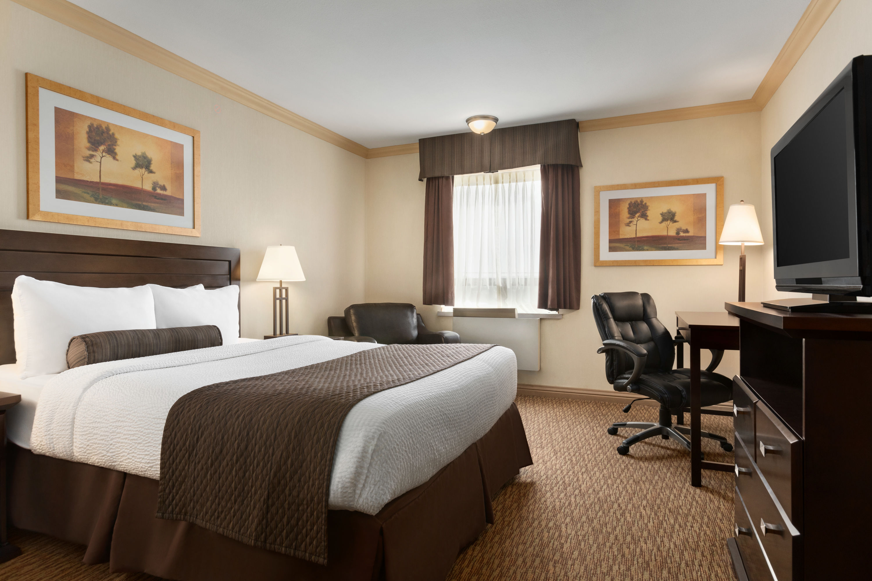 Guest room at the Days Inn & Suites by Wyndham Sault Ste. Marie ON in Sault Ste Marie, Ontario