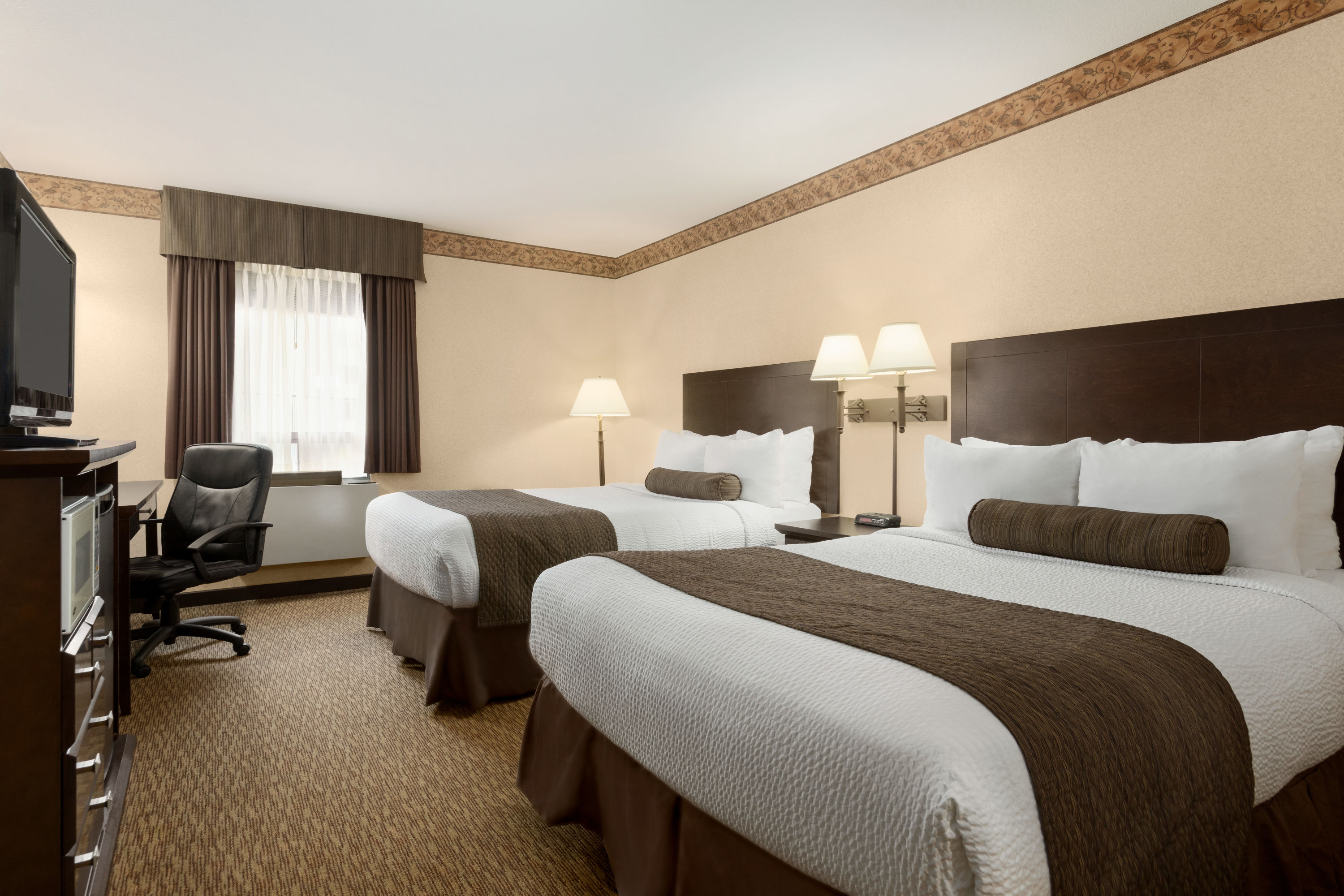 Guest room at the Days Inn & Suites by Wyndham Sault Ste. Marie ON in Sault Ste Marie, Ontario