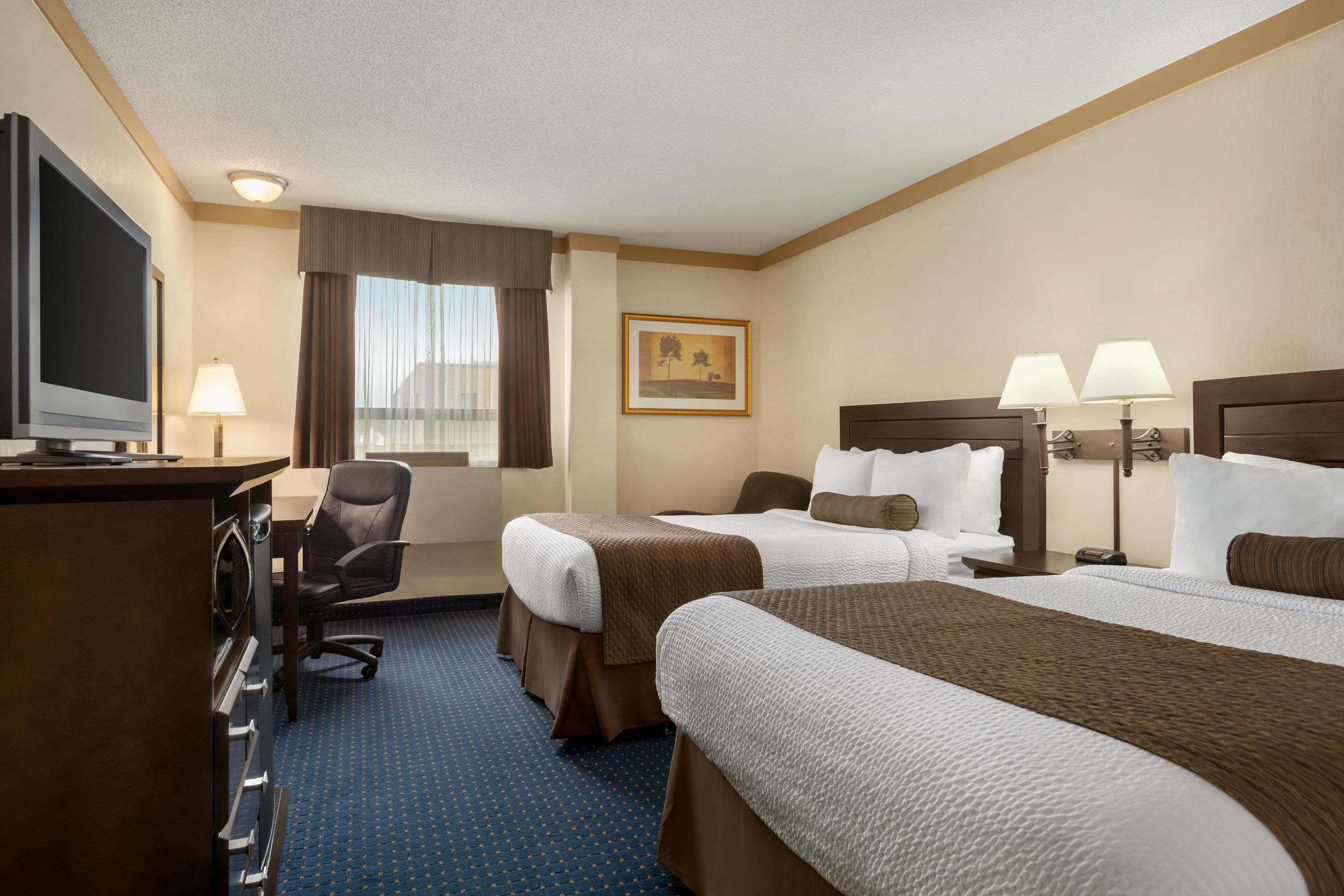 Guest room at the Days Inn & Suites by Wyndham Sault Ste. Marie ON in Sault Ste Marie, Ontario