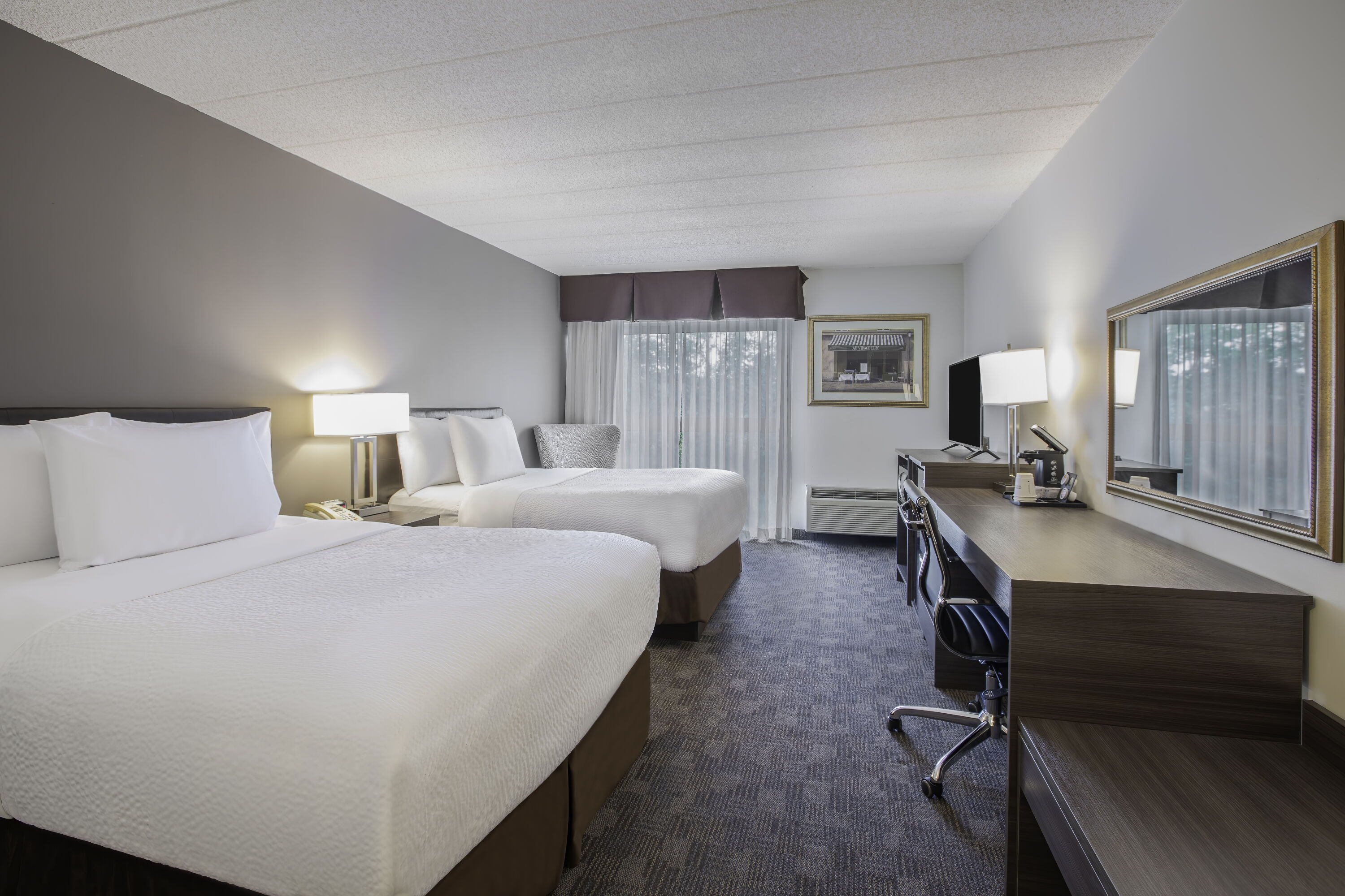 Double bed guest room at the Days Inn by Wyndham Sudbury & Conference Centre in Sudbury, Ontario