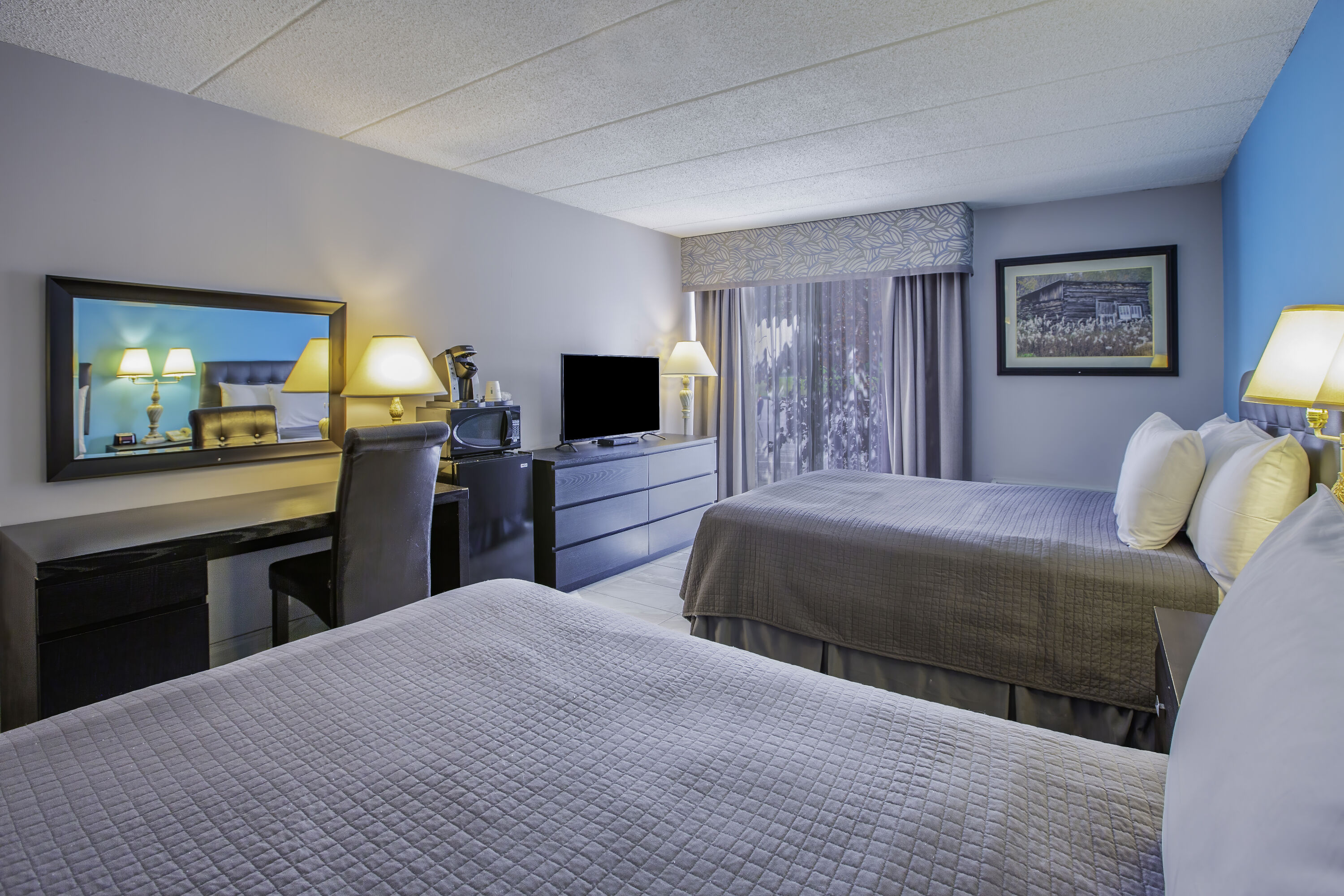 Double bed guest room at the Days Inn by Wyndham Sudbury & Conference Centre in Sudbury, Ontario