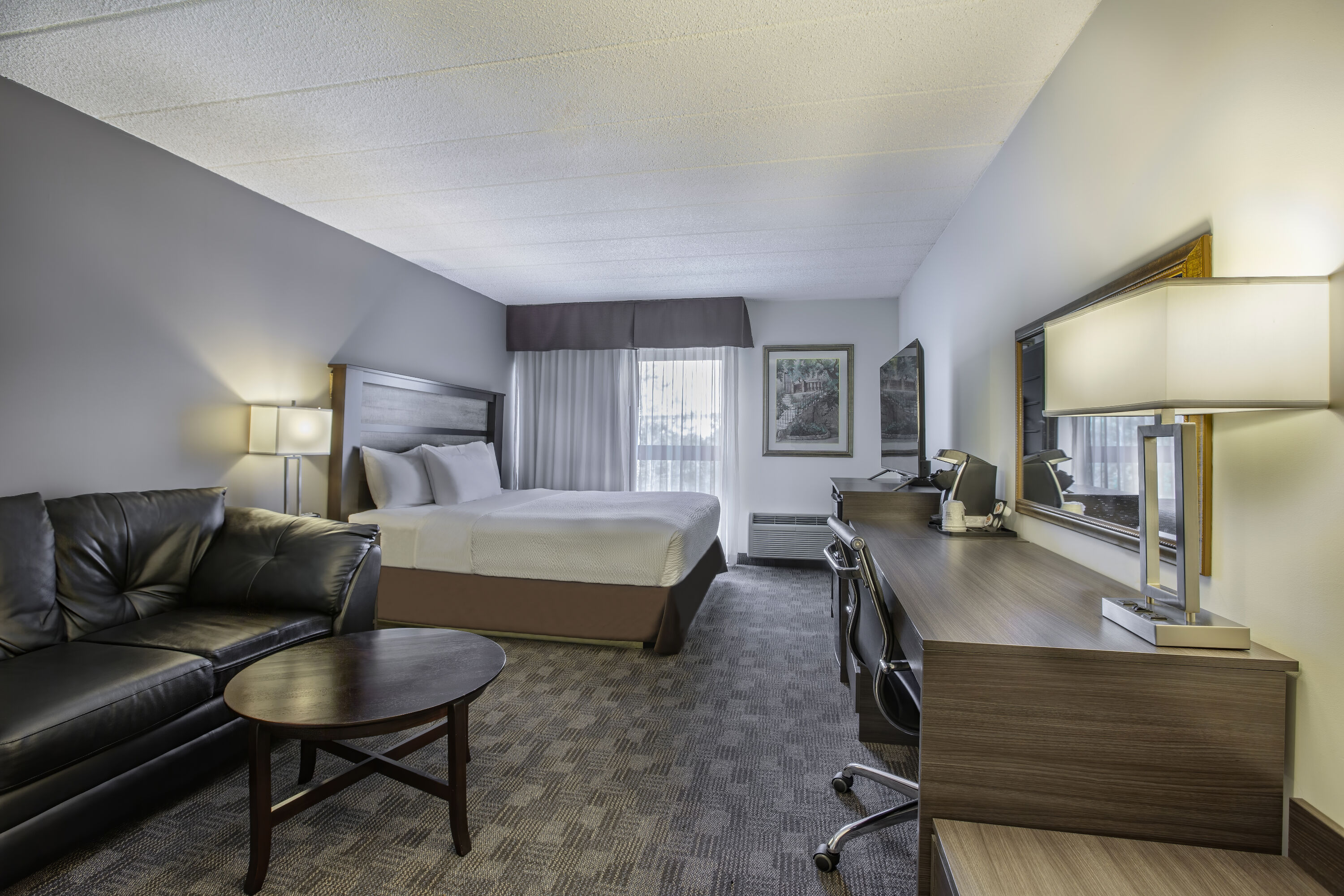 King bed guest room at the Days Inn by Wyndham Sudbury & Conference Centre in Sudbury, Ontario