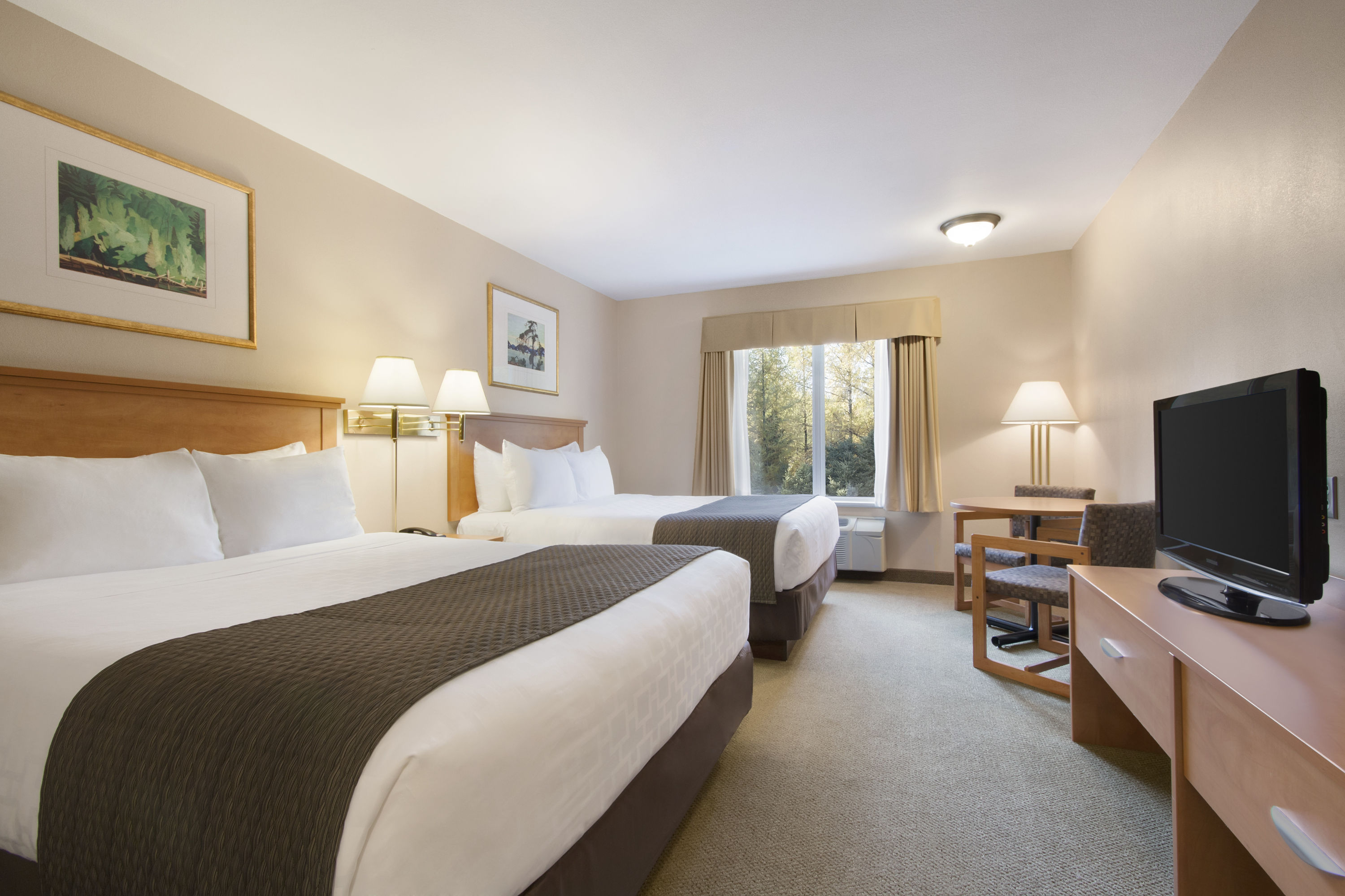 Guest room at the Days Inn & Suites by Wyndham Thunder Bay in Thunder Bay, Ontario