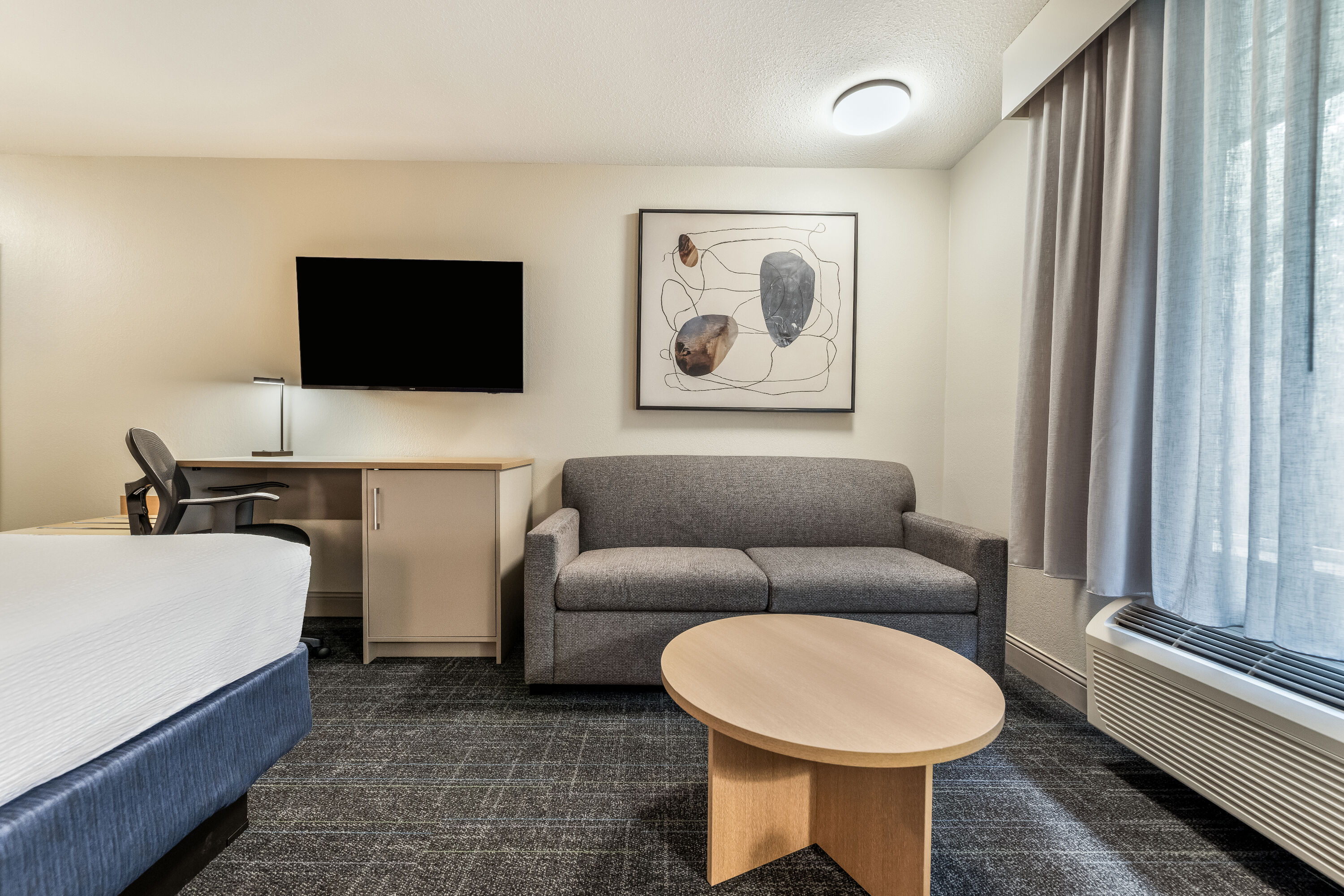 King bed guest room at the Days Inn & Suites by Wyndham Thunder Bay in Thunder Bay, Ontario