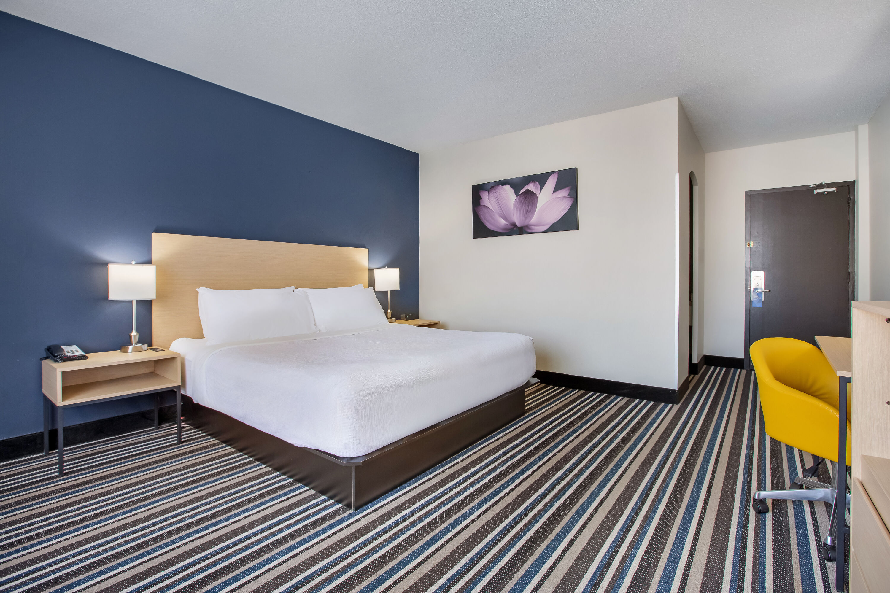 King bed guest room at the Days Inn by Wyndham Montreal Airport Conference Centre in Montreal, Quebec