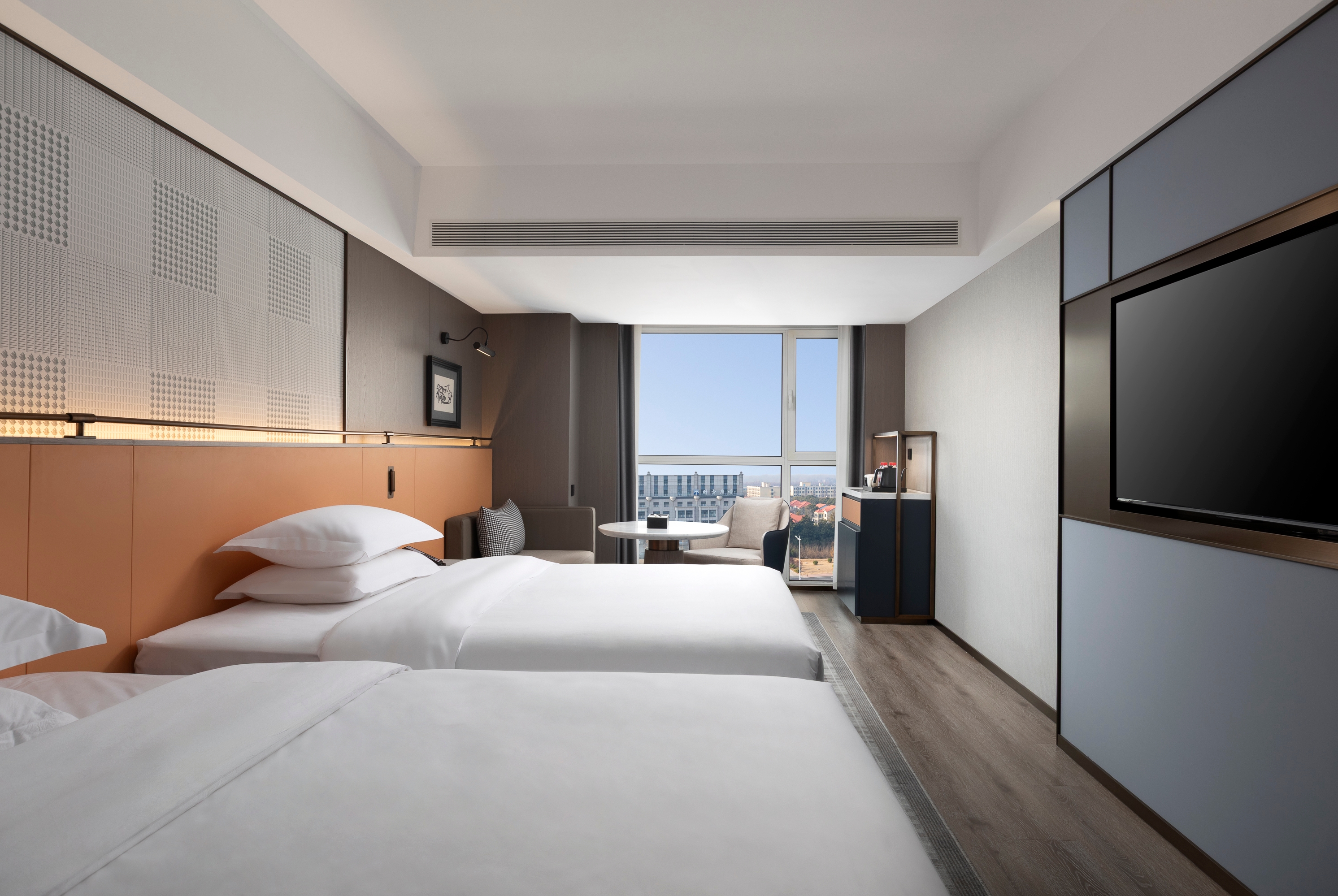 Guest room at the Days Inn by Wyndham Zhengzhou Xinzheng Airport in Zhengzhou, Other than US/Canada