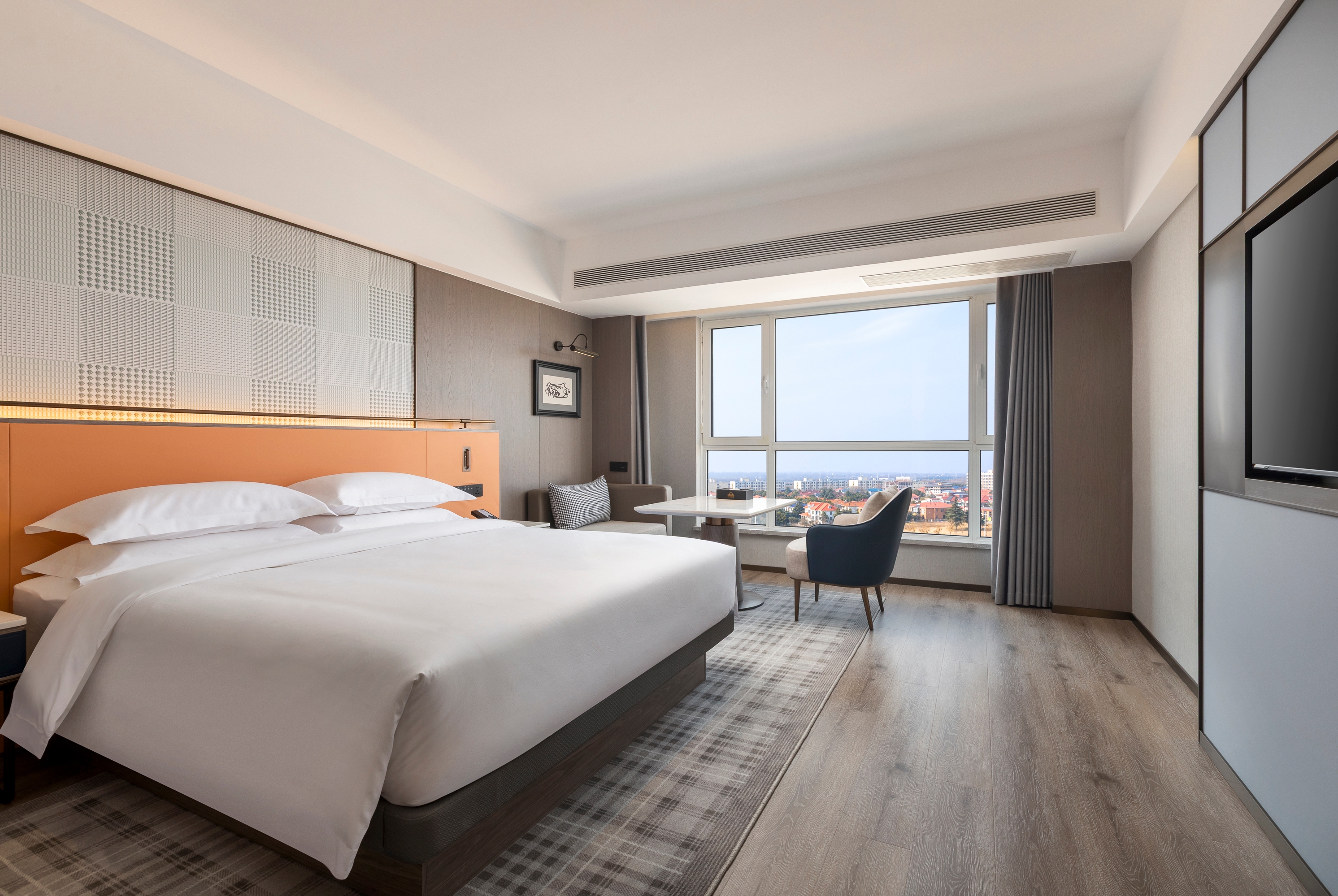 Guest room at the Days Inn by Wyndham Zhengzhou Xinzheng Airport in Zhengzhou, Other than US/Canada