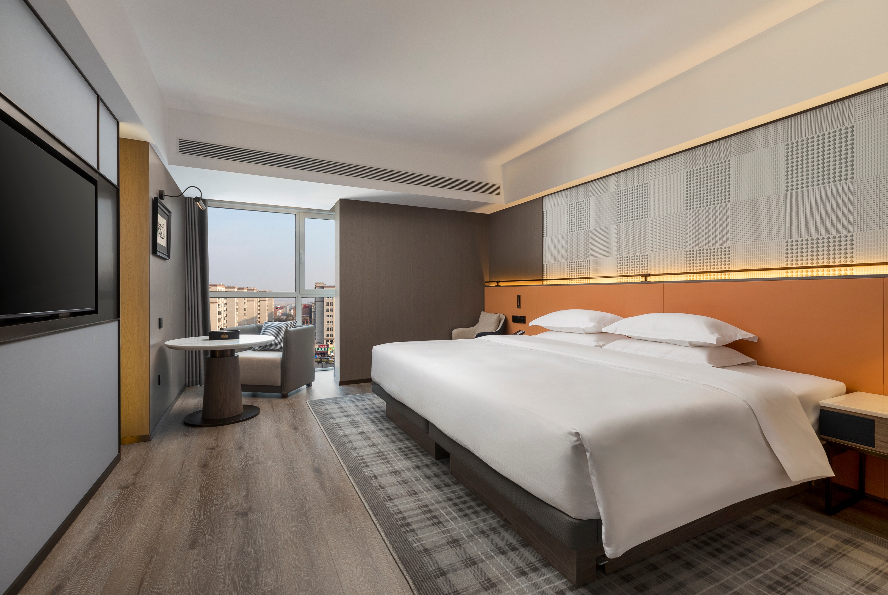 Guest room at the Days Inn by Wyndham Zhengzhou Xinzheng Airport in Zhengzhou, Other than US/Canada