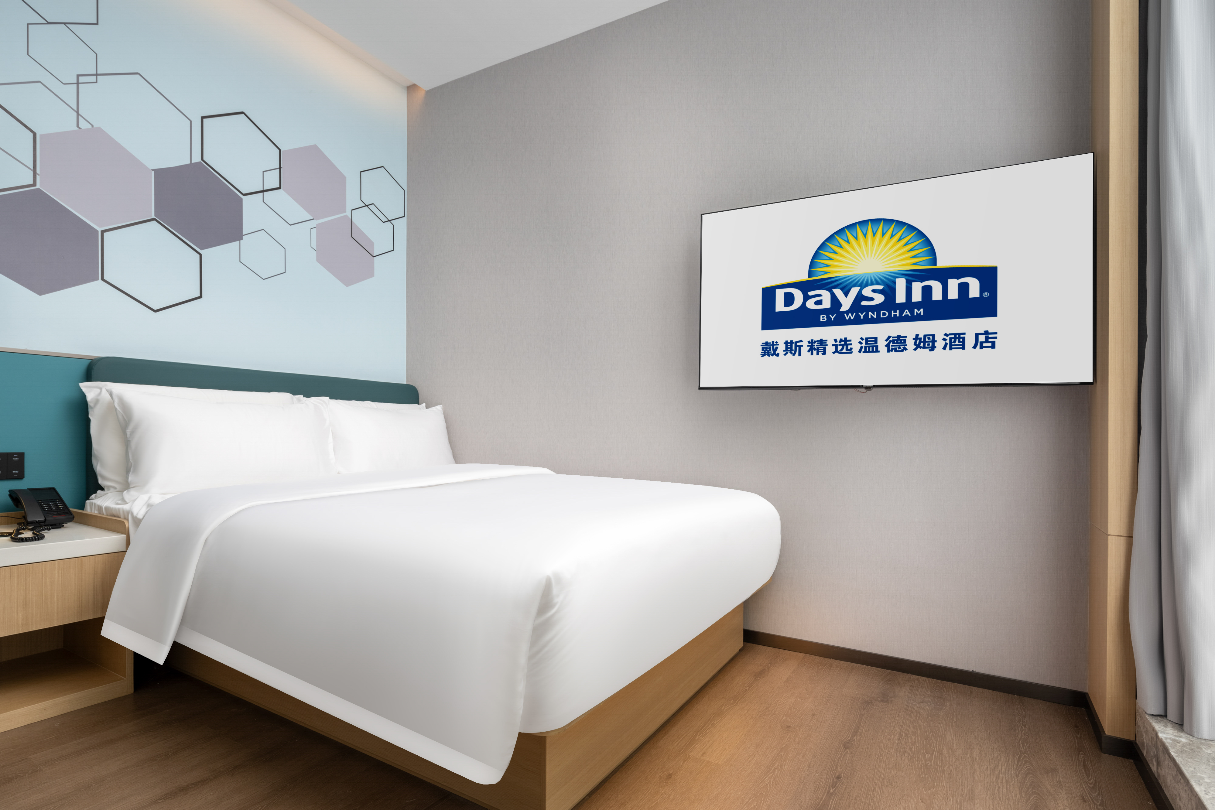 Guest room at the Days Inn by Wyndham Zhuhai Gongbei Port in Zhuhai, Other than US/Canada