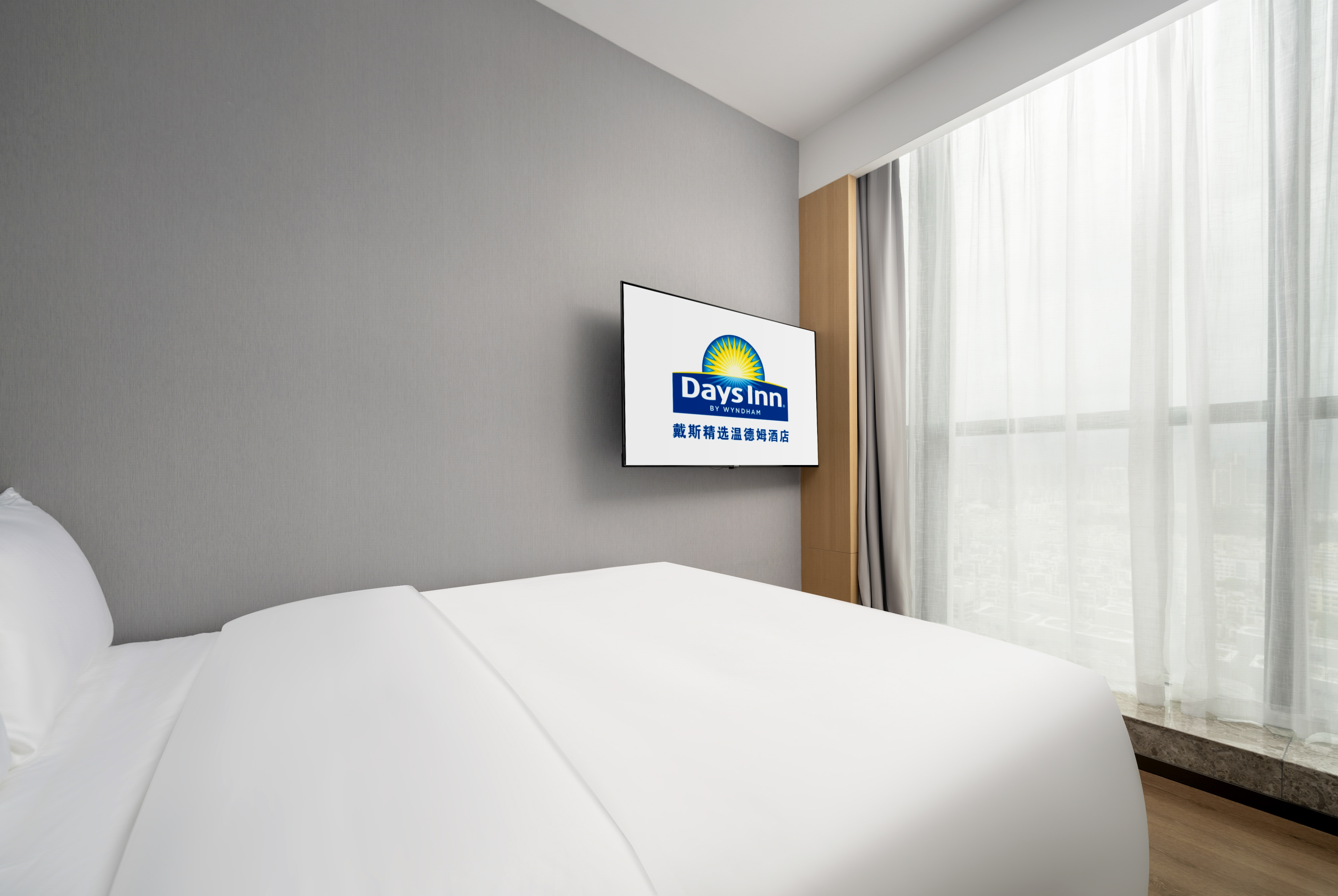 Guest room at the Days Inn by Wyndham Zhuhai Gongbei Port in Zhuhai, Other than US/Canada
