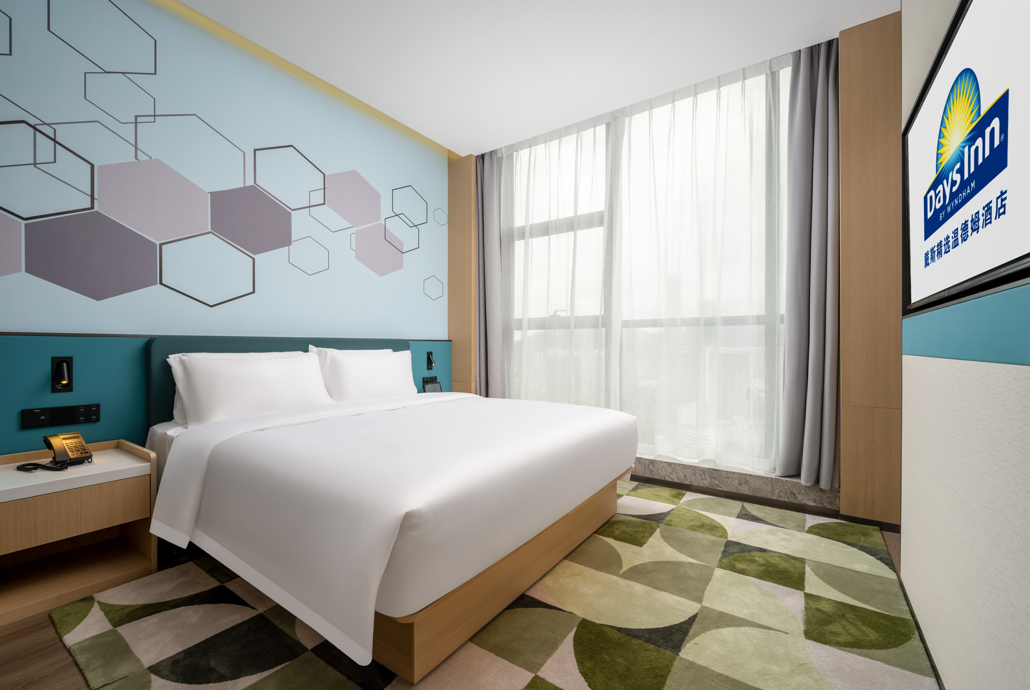Guest room at the Days Inn by Wyndham Zhuhai Gongbei Port in Zhuhai, Other than US/Canada