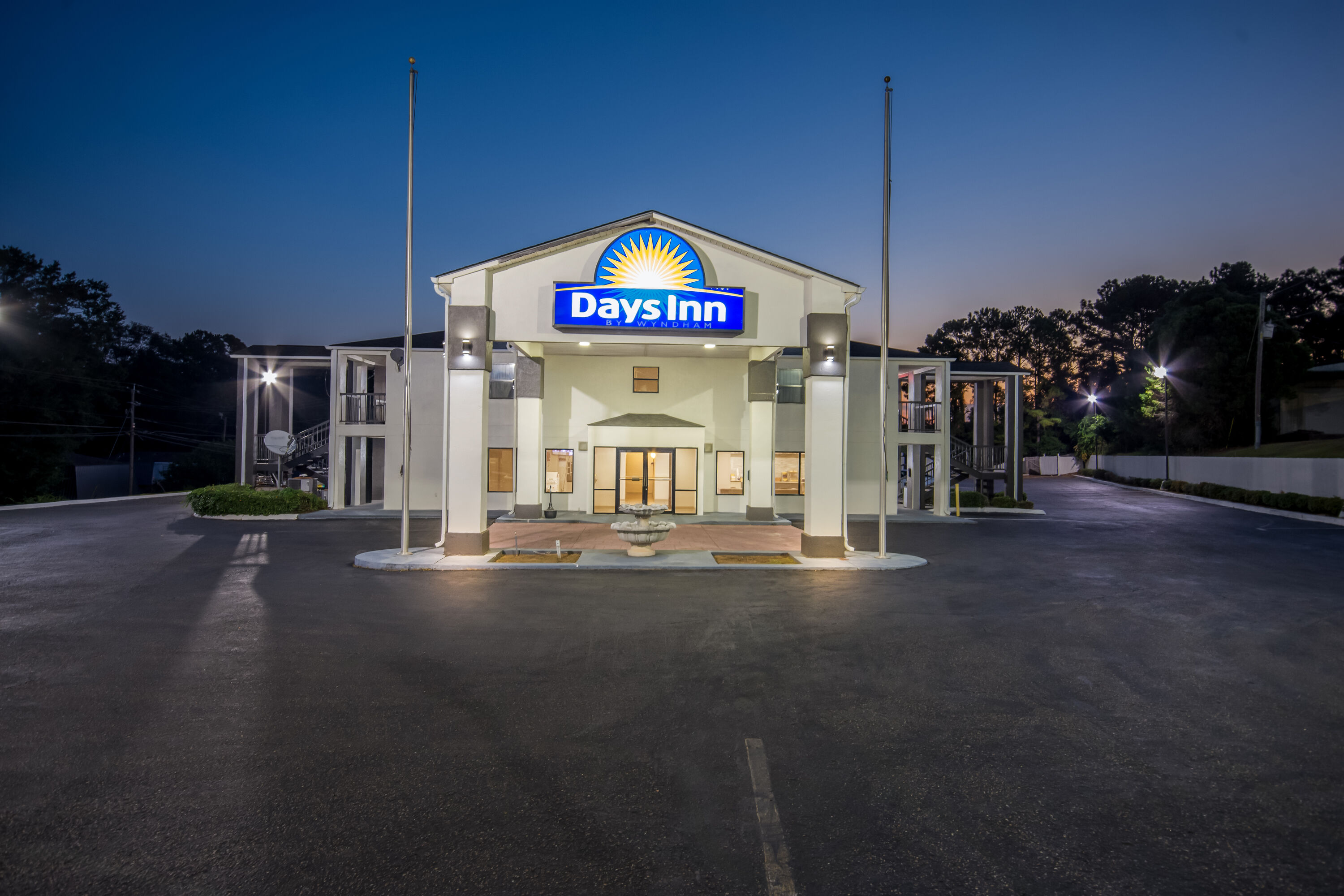 Exterior Night Image of Days Inn by Wyndham Enterprise hotel in Enterprise, Alabama