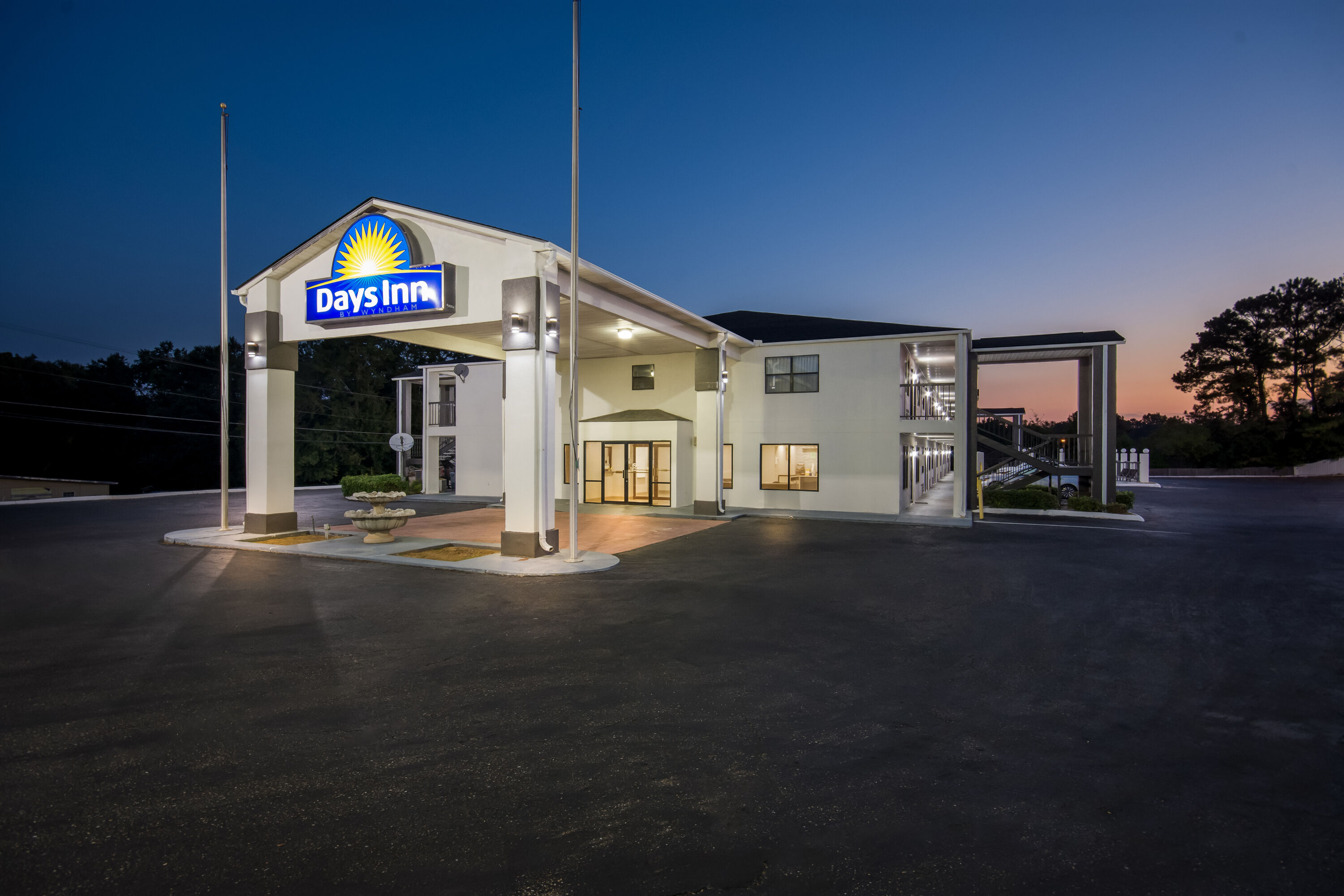 Exterior Night Image of Days Inn by Wyndham Enterprise hotel in Enterprise, Alabama