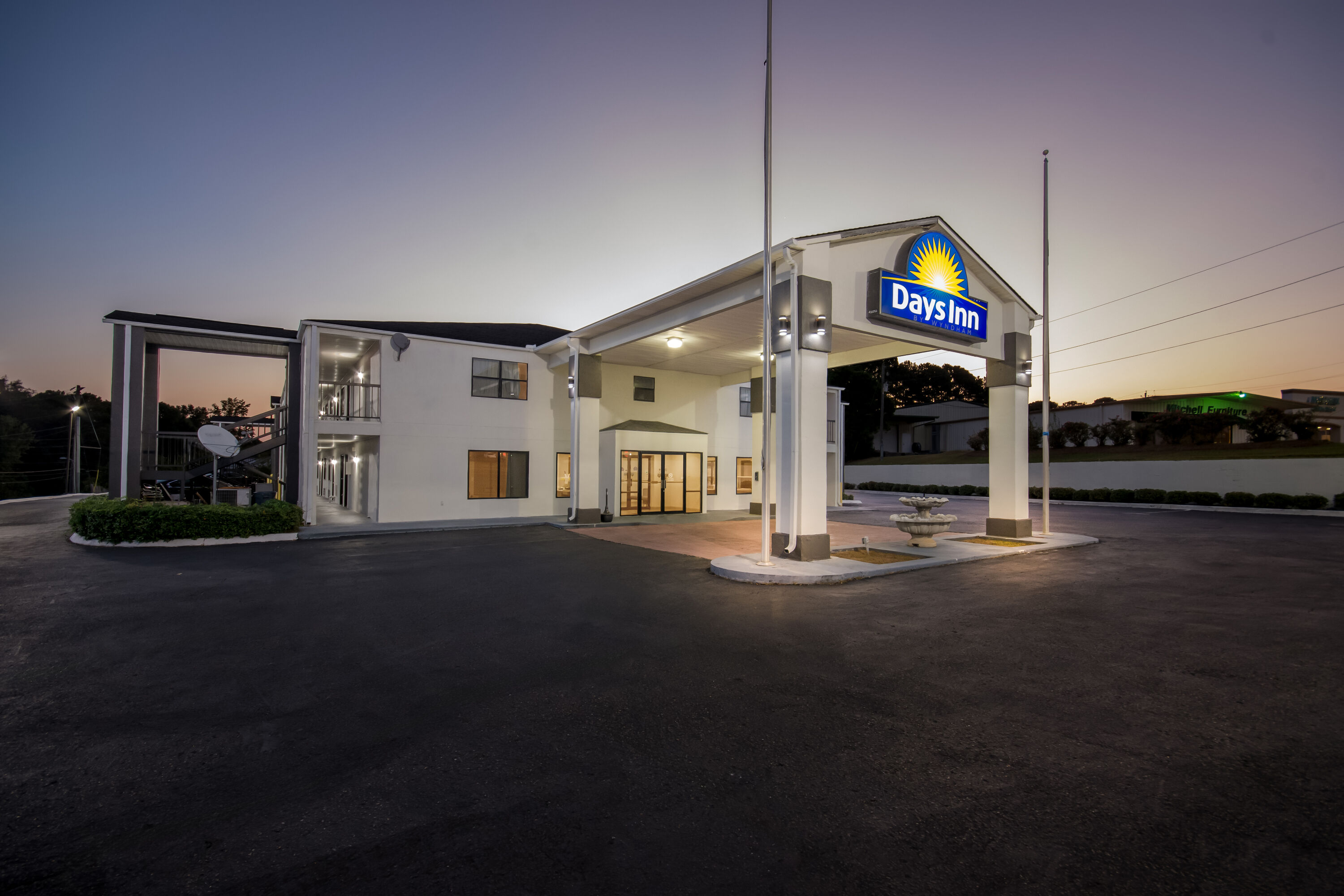 Exterior Night Image of Days Inn by Wyndham Enterprise hotel in Enterprise, Alabama