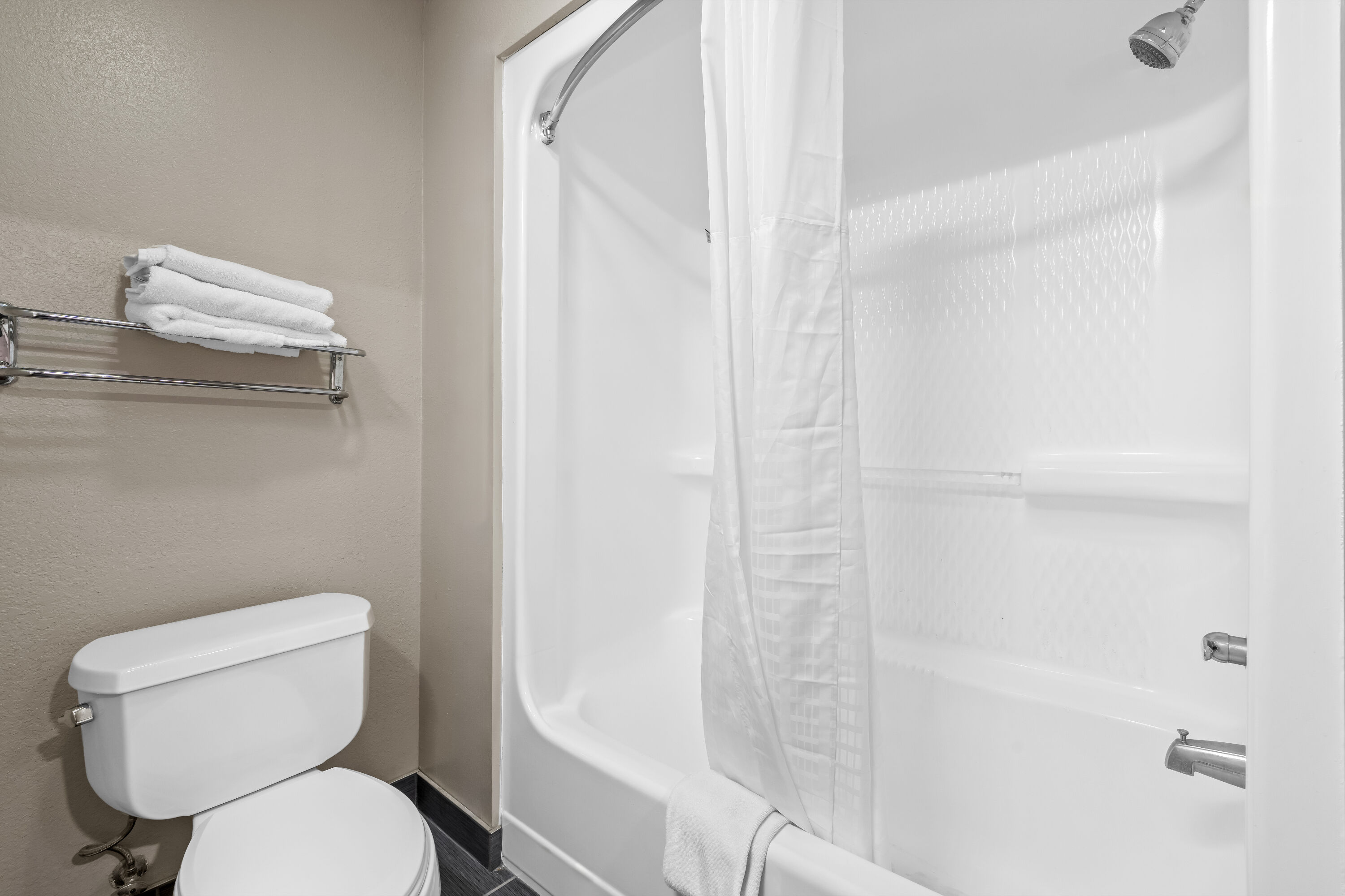 Guest room bath at the Days Inn by Wyndham Troy in Troy, Alabama