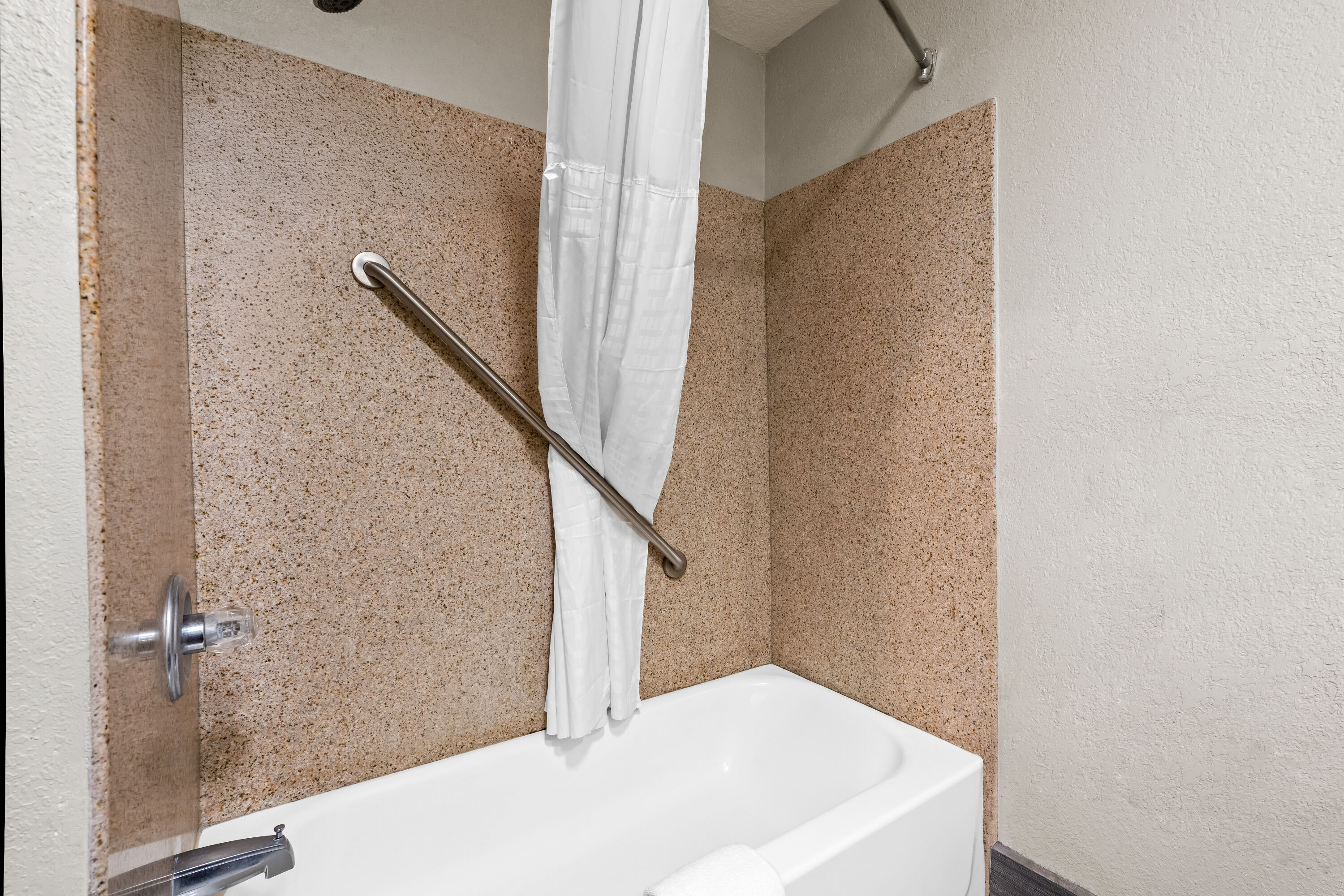Guest room bath at the Days Inn by Wyndham Troy in Troy, Alabama