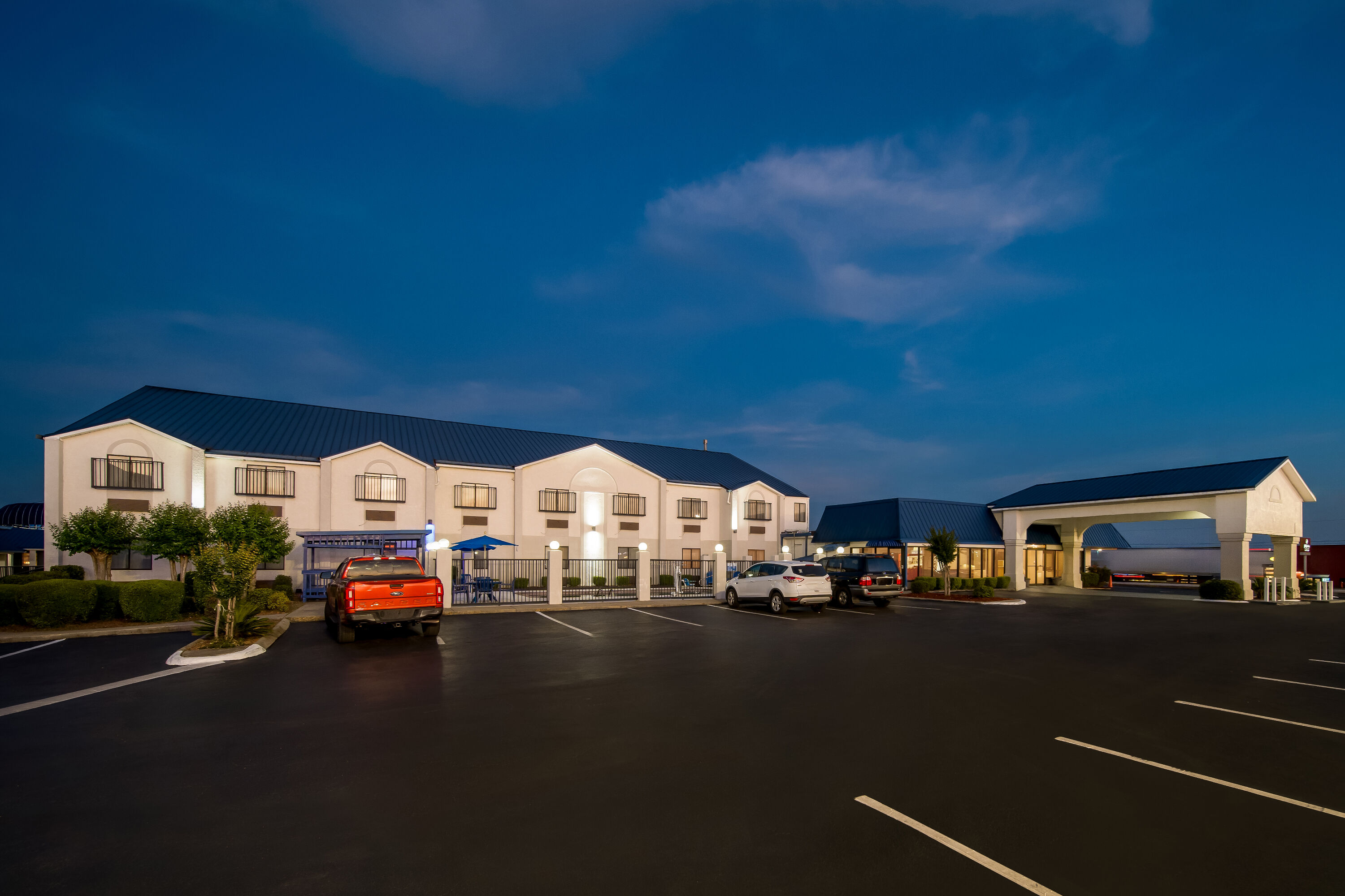 Exterior Night Image of Days Inn by Wyndham Troy hotel in Troy, Alabama