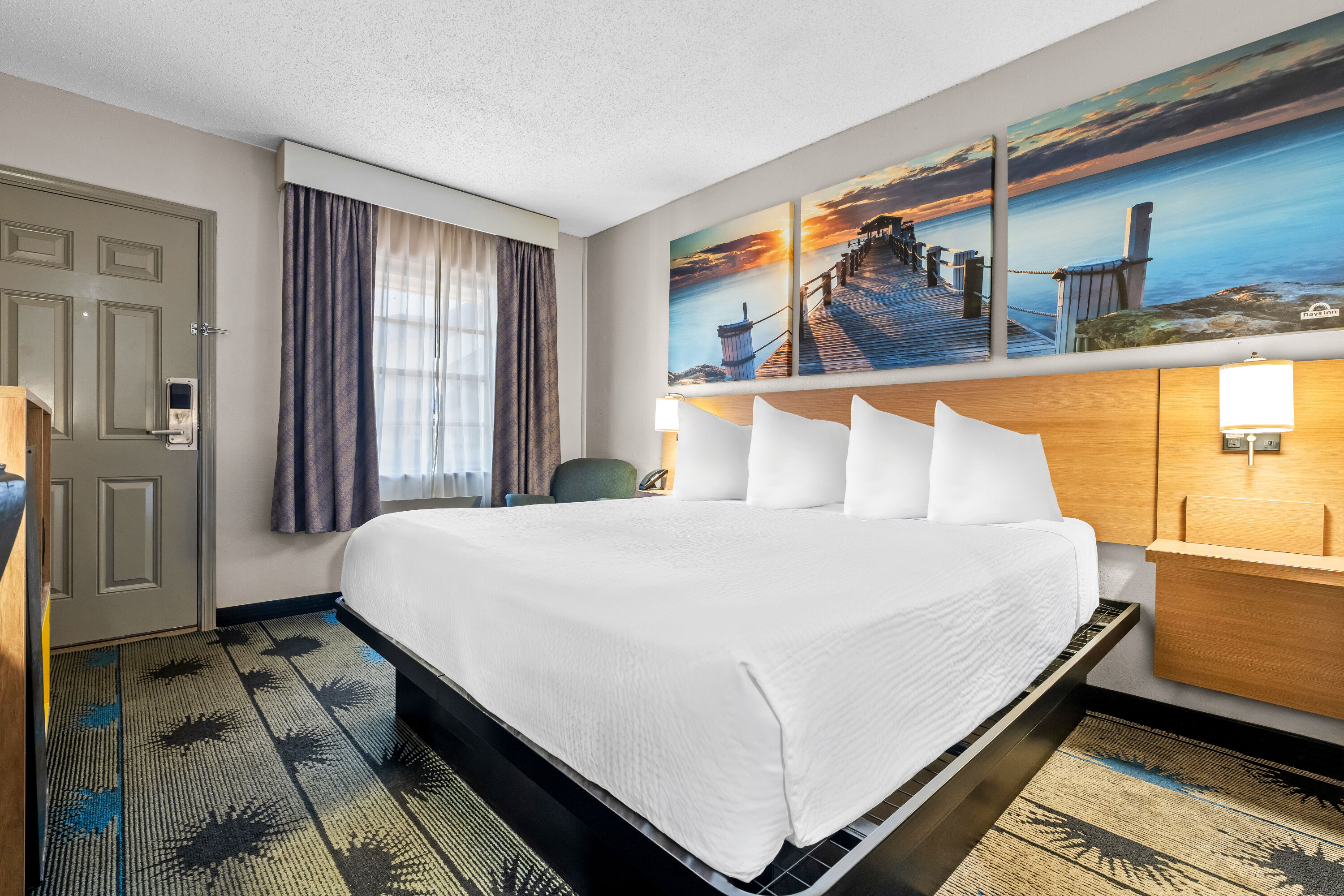King bed guest room at the Days Inn by Wyndham Troy in Troy, Alabama
