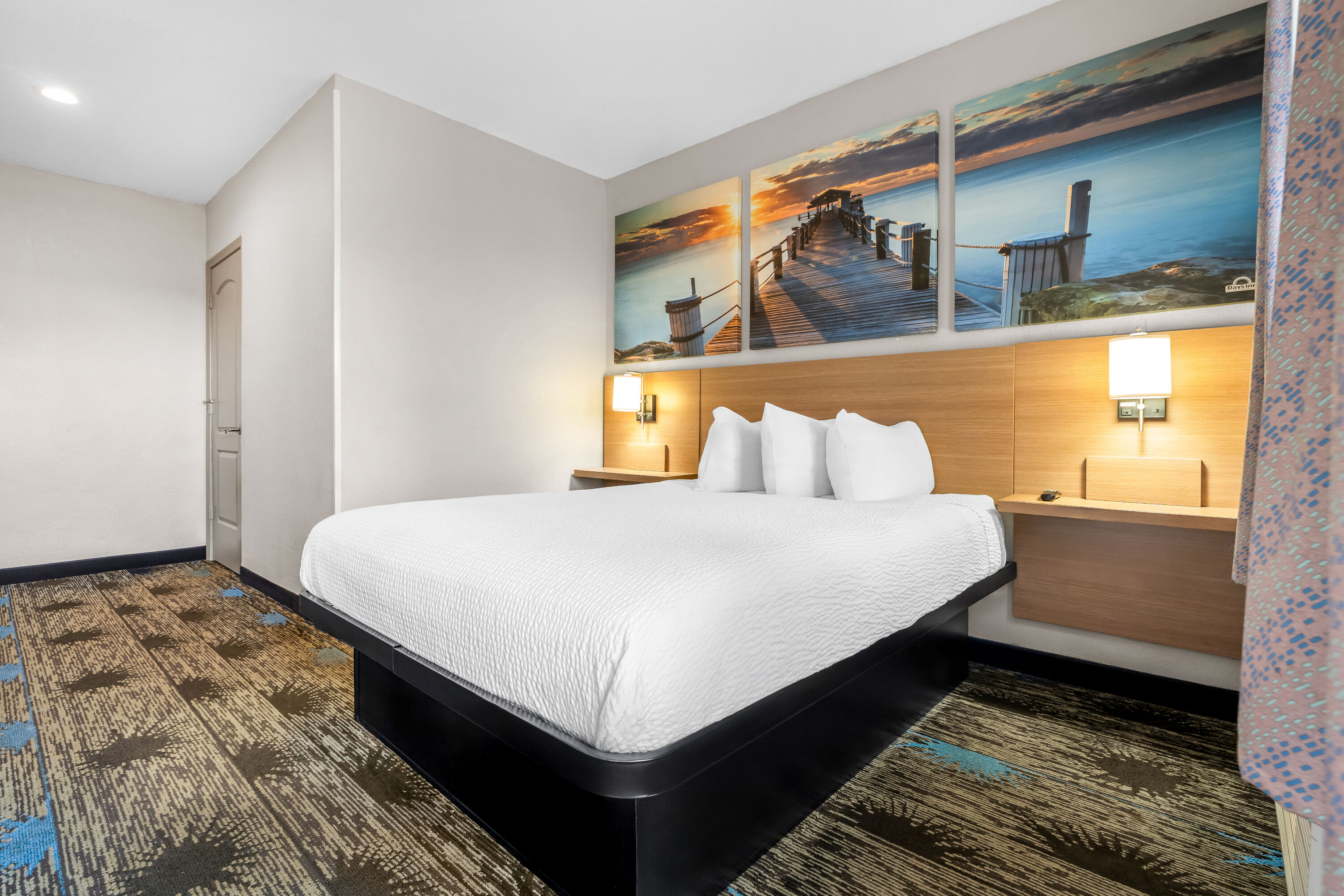 King bed guest room at the Days Inn by Wyndham Troy in Troy, Alabama