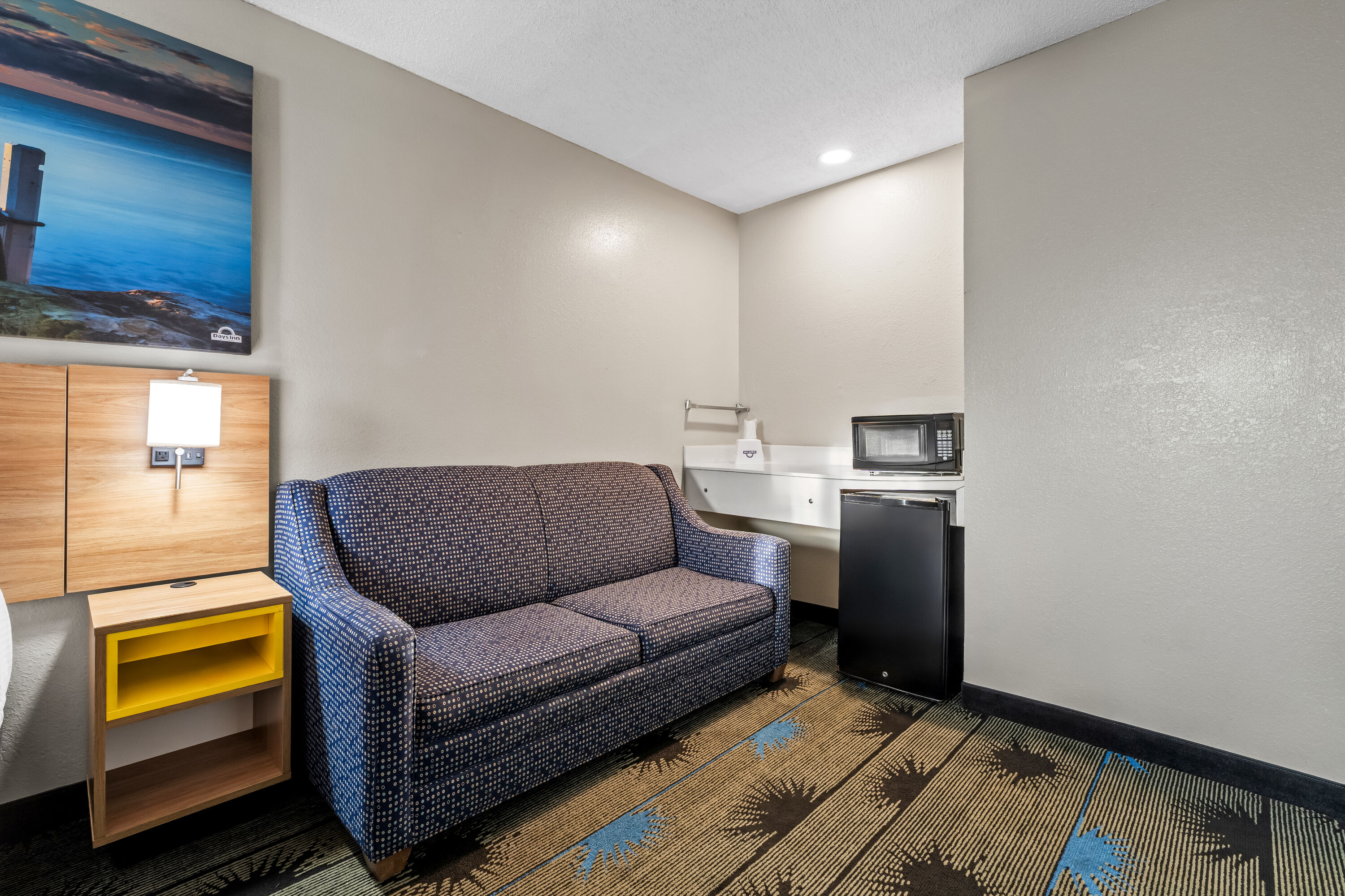 King bed guest room at the Days Inn by Wyndham Troy in Troy, Alabama