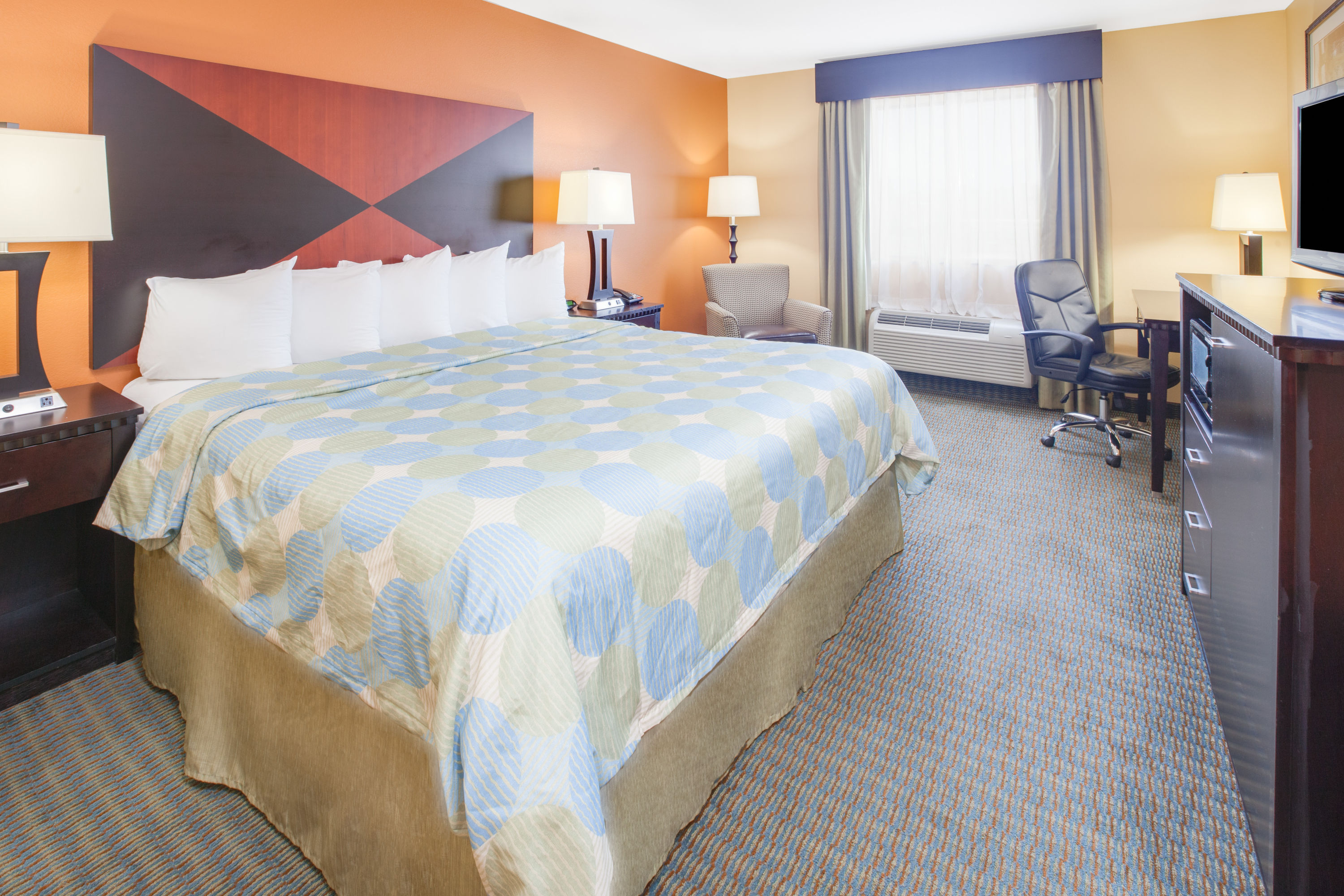 Guest room at the Days Inn & Suites by Wyndham Russellville in Russellville, Arkansas