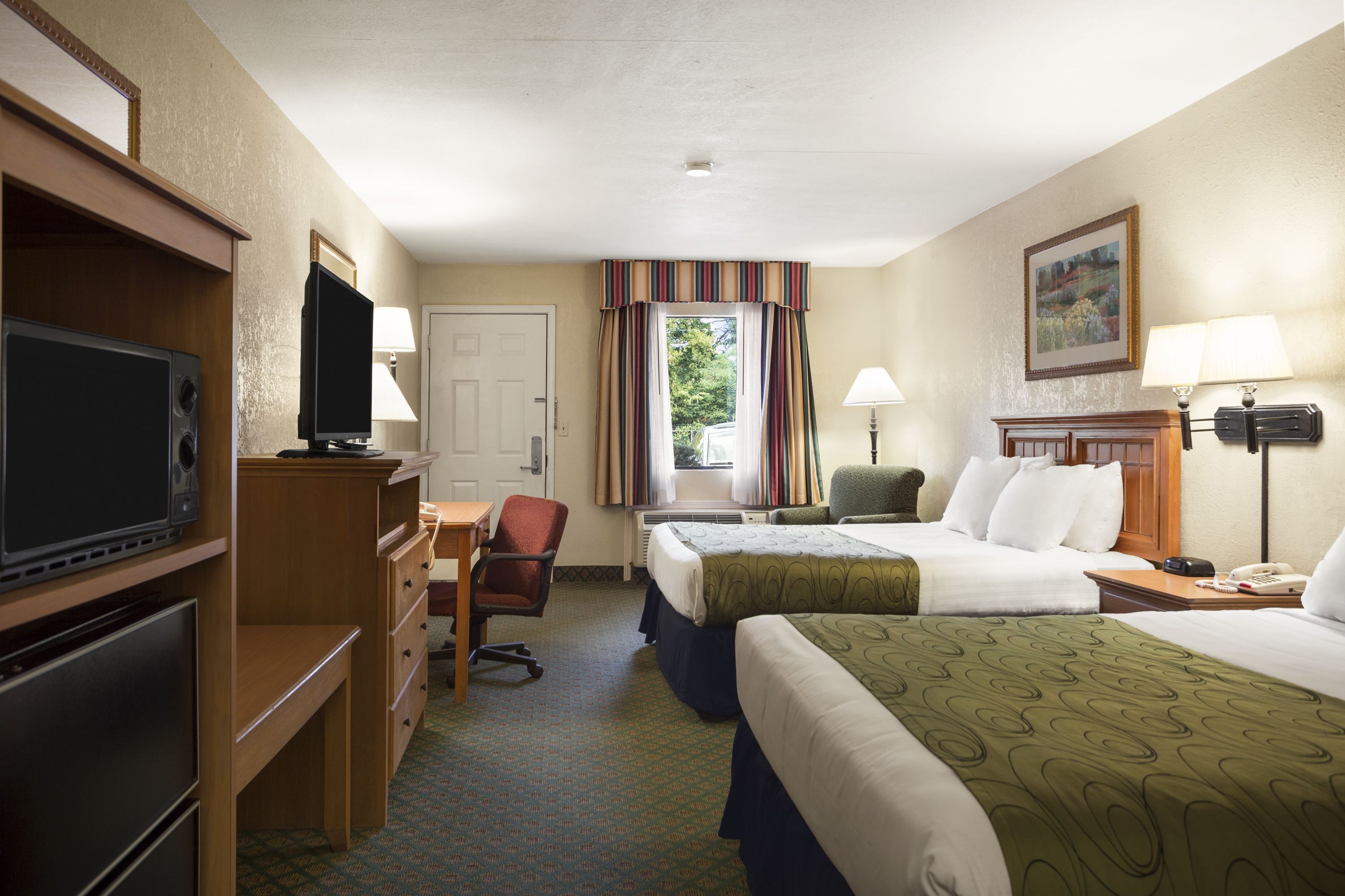 Guest room at the Days Inn & Suites by Wyndham Stuttgart in Stuttgart, Arkansas