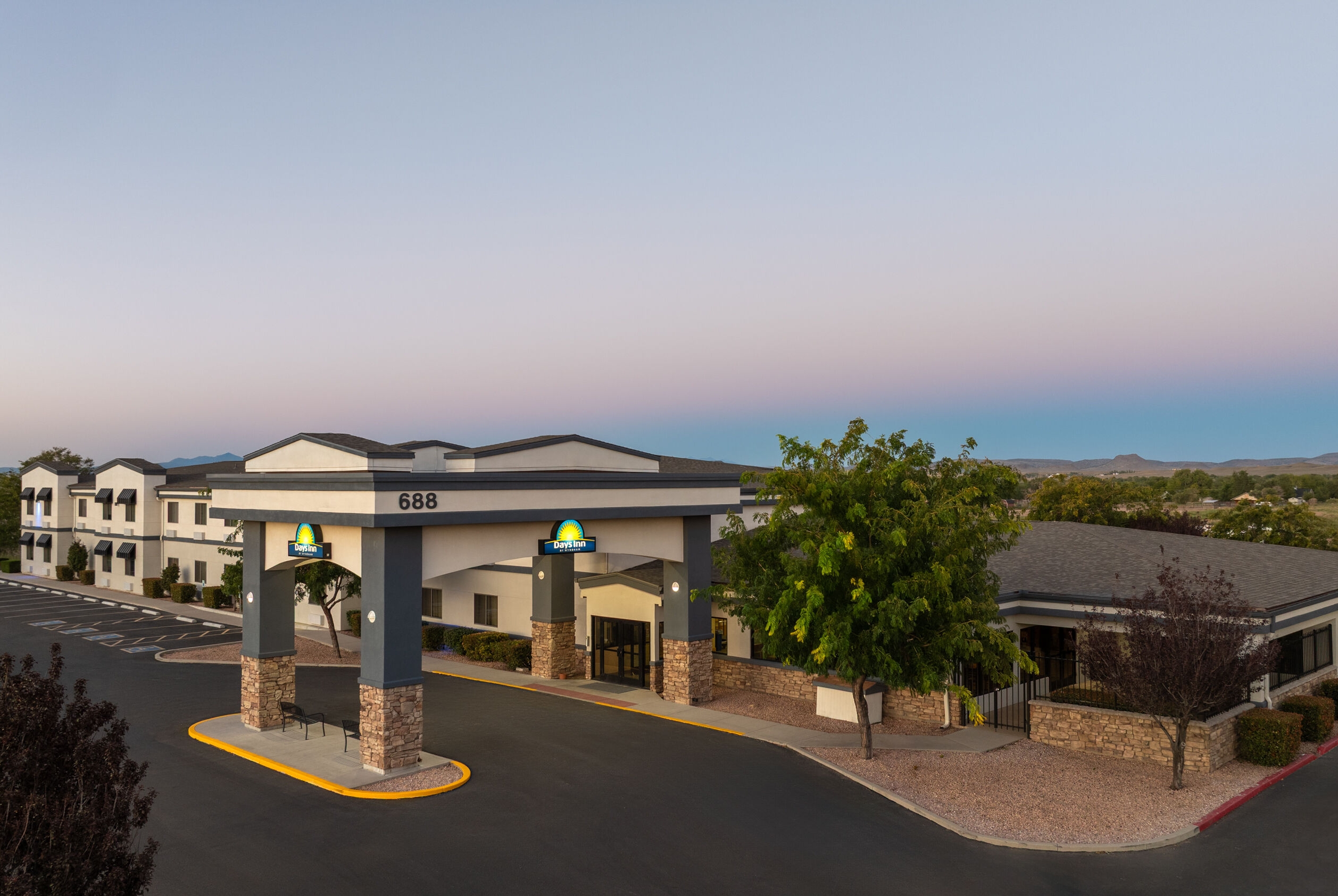 Exterior Dusk Image of Days Inn by Wyndham Chino Valley hotel in Chino Valley, Arizona